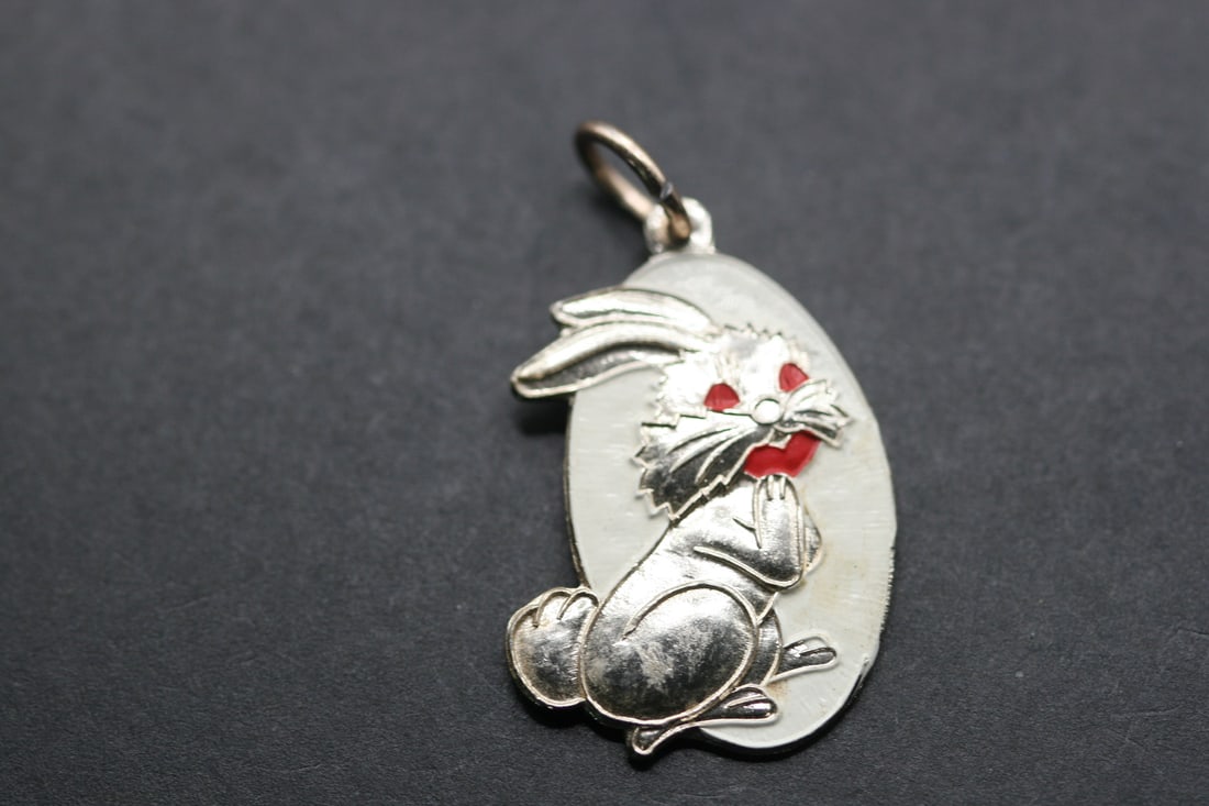 Rabbit Pendant 1940's war time painted tin Vintage Lot 858: Rabbit Pendant 1940's war time painted tin Vintage measures 1/4" x 7/8"