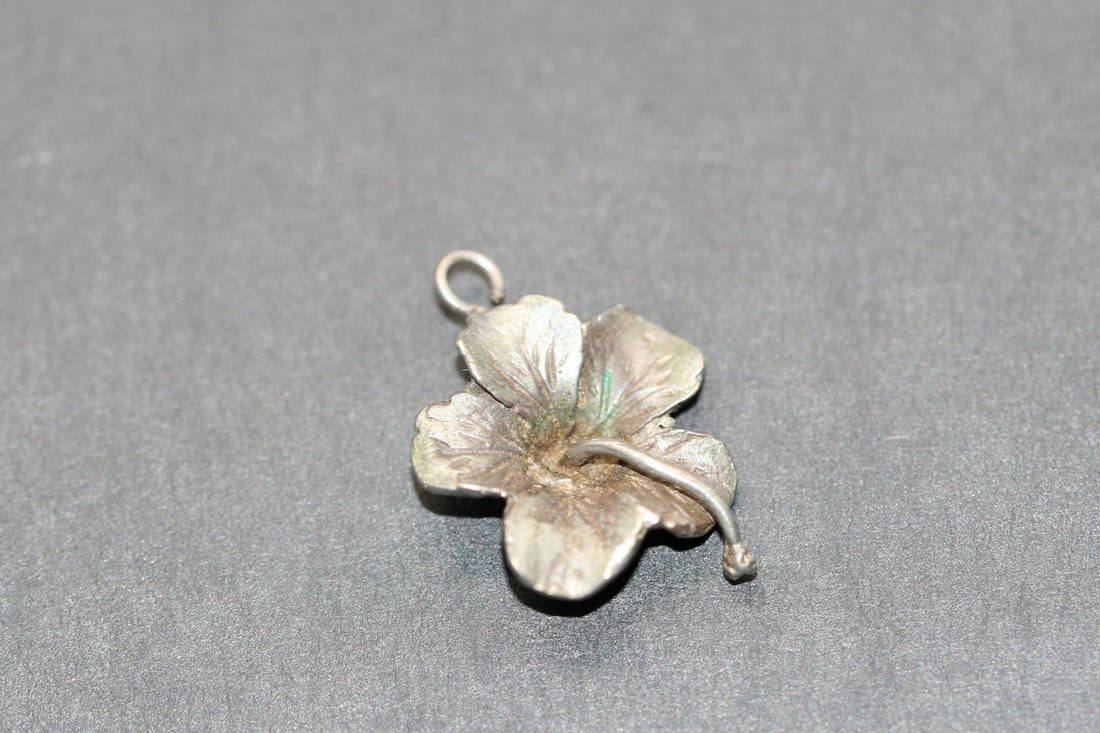 Hibiscus Charm Pendant Vintage Silver Lot 945: Hibiscus Charm Pendant Vintage Silver unsigned measures 3/4" in diameter