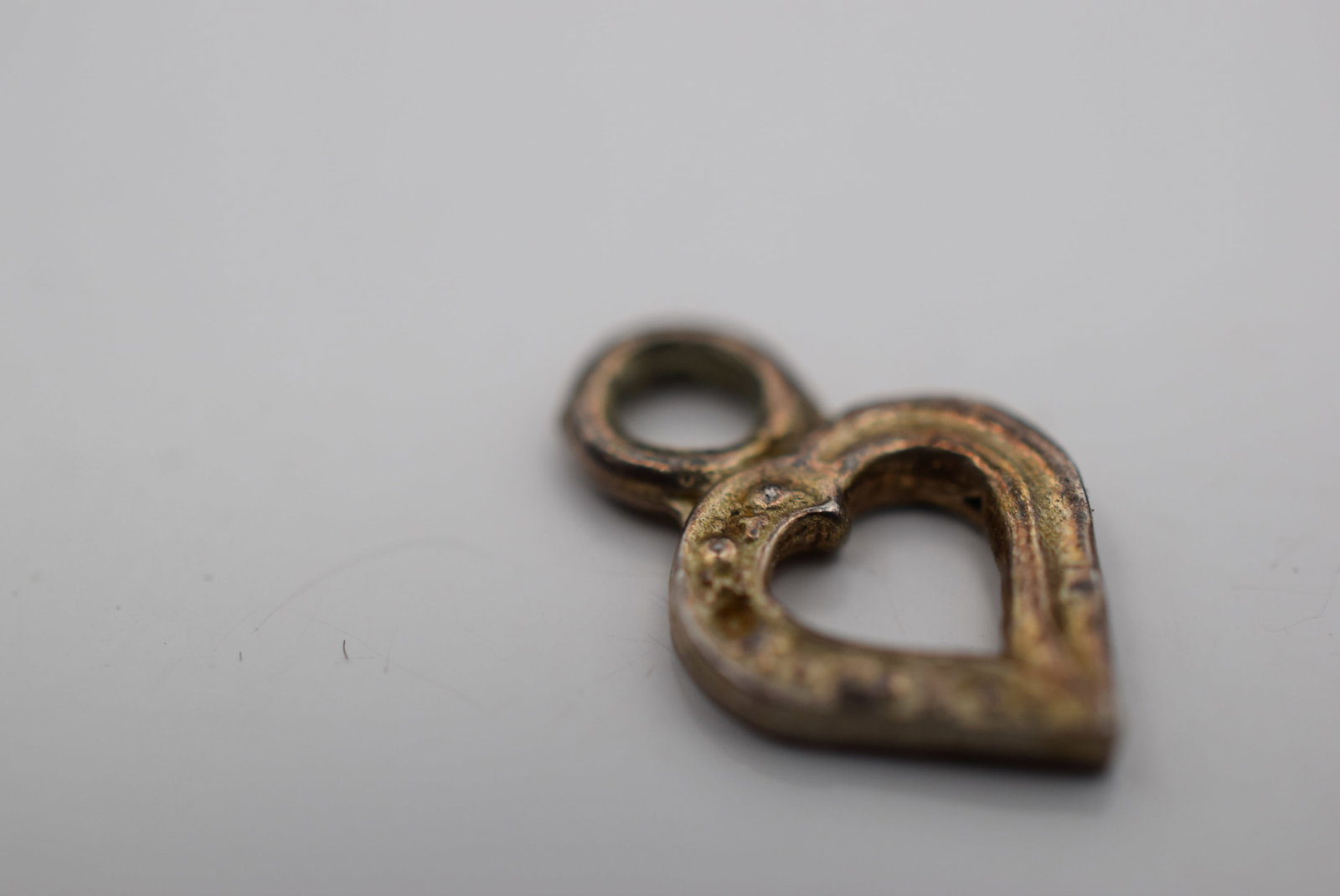 Tiny Heart Charm Sterling Vintage Lot HK 1151: Tiny Heart Charm Sterling Vintage measures 1/2" x 3/8"