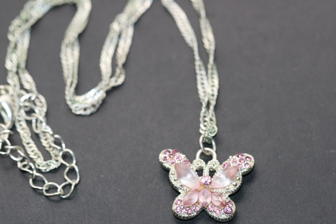 Pink Rose Butterfly Rhinestone Pendant Necklace Lot 1238: Pink Rose Butterfly Rhinestone Pendant Necklace pendant measures 7/8" x 3/4" and the chain measures 18" long