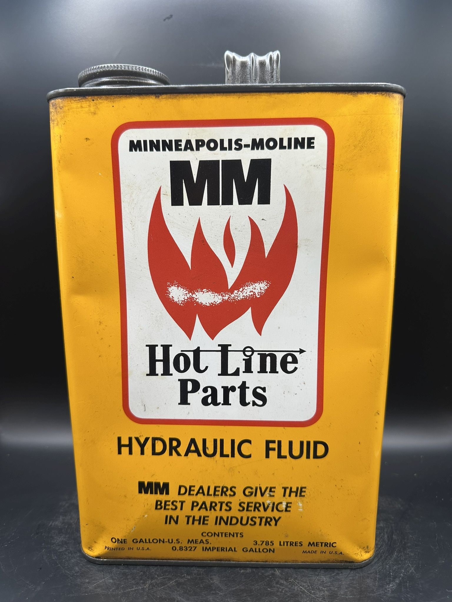 Minneapolis Moline Gallon: Has some dents, scratches, empty, yellow is vibrant