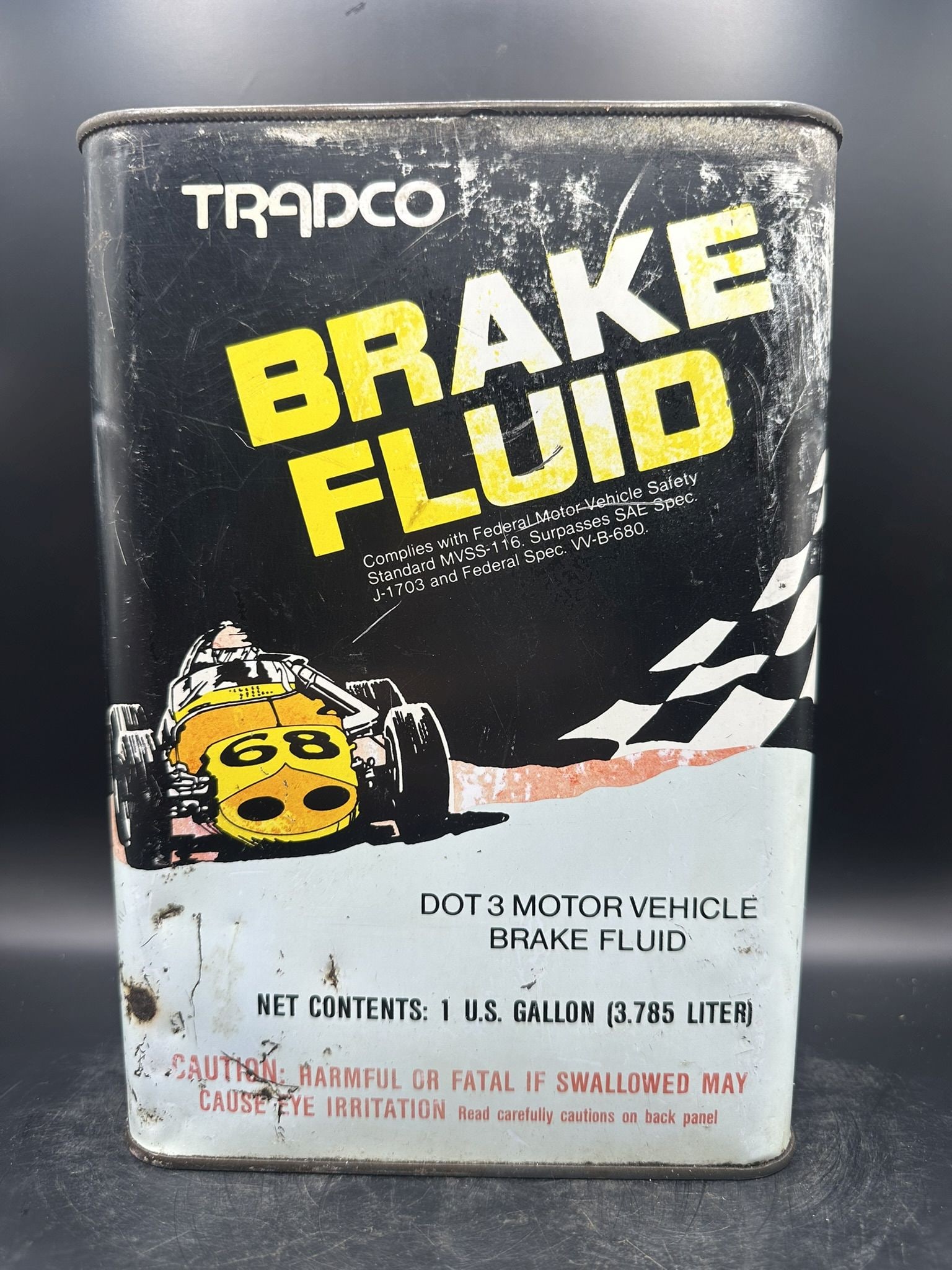 Tradco Brake Fluid Gallon: No top, empty, has fade and scratches, nice racing graphics