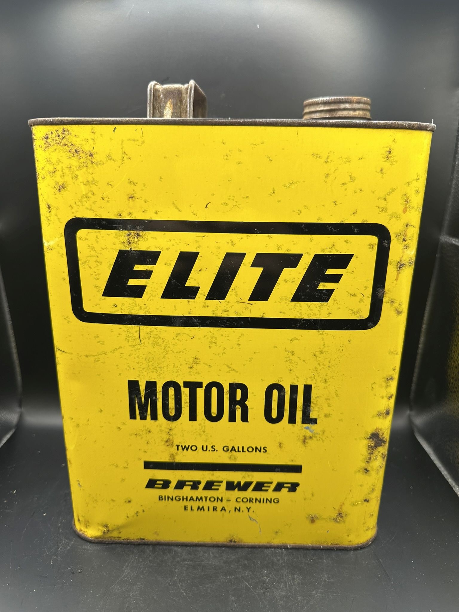 Elite Motor Oil Two Gallon: Pitting throughout, bright yellow color, empty