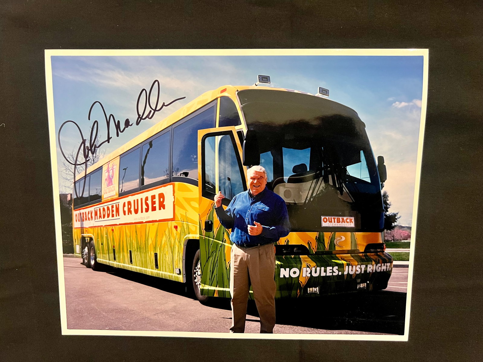 John Madden Football Coach and Broadcaster Autographed 8" x 10" photo in front of his "Outback: Item: John Madden Football Coach and Broadcaster Autographed 8" x 10" photo in front of his "Outback Madden Cruiser" Please look at the pictures carefully to determine what you believe the condition o
