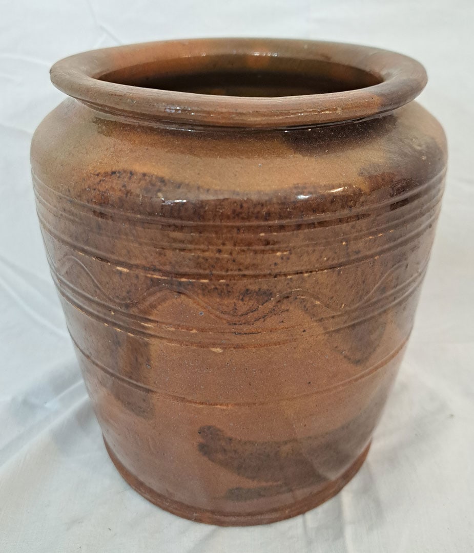 Incised redware jar.: 7" Wide x 7" Tall.