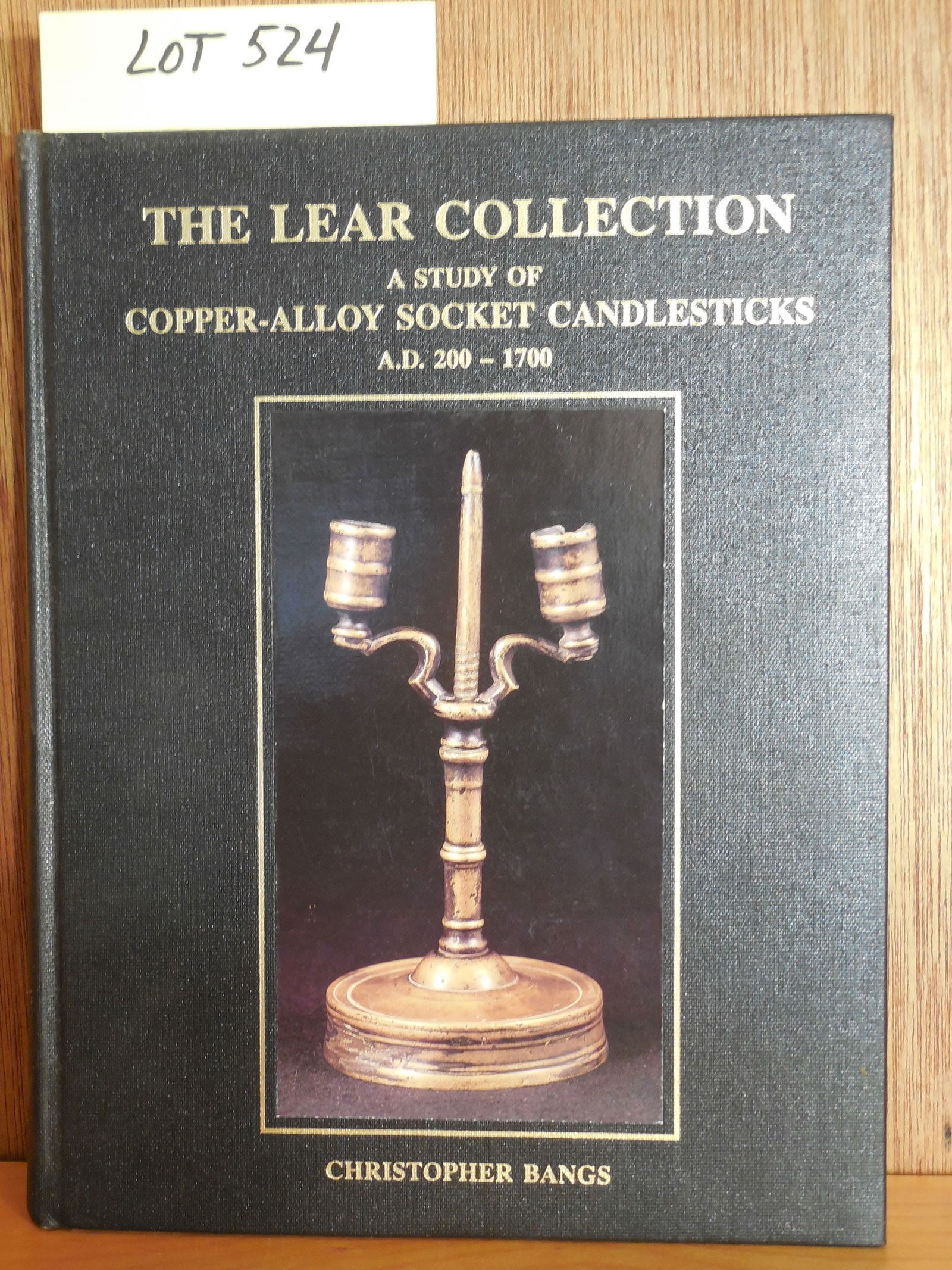 "The Lear Collection: A Study of Copper-Alloy Socket Candlesticks A.D. 200-1700" Book Lot: "The Lear Collection: A Study of Copper-Alloy Socket Candlesticks A.D. 200-1700" Book Lot by Christopher Bangs. Copyright 1995.