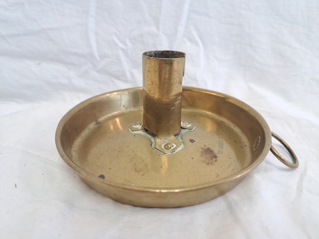 Brass Candlestick signed "Skultana.": 2 1/8" tall x 4 1/2" wide at base.
