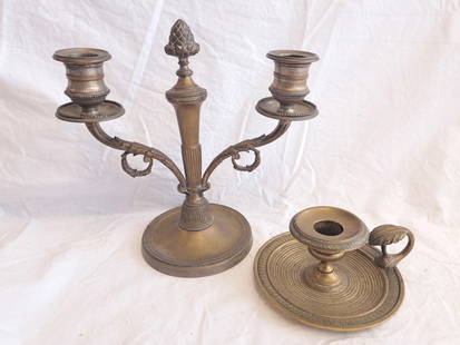 Lot of Two: One Brass Signed Candelabra and one Chamber Candlestick.: Candelabra: Signed "HL." 8" tall x 8 1/2" wide X 4 1/2" at base. Chamber Candlestick: 2 1/4" tall with Bobeche x 5 1/2" wide at base.