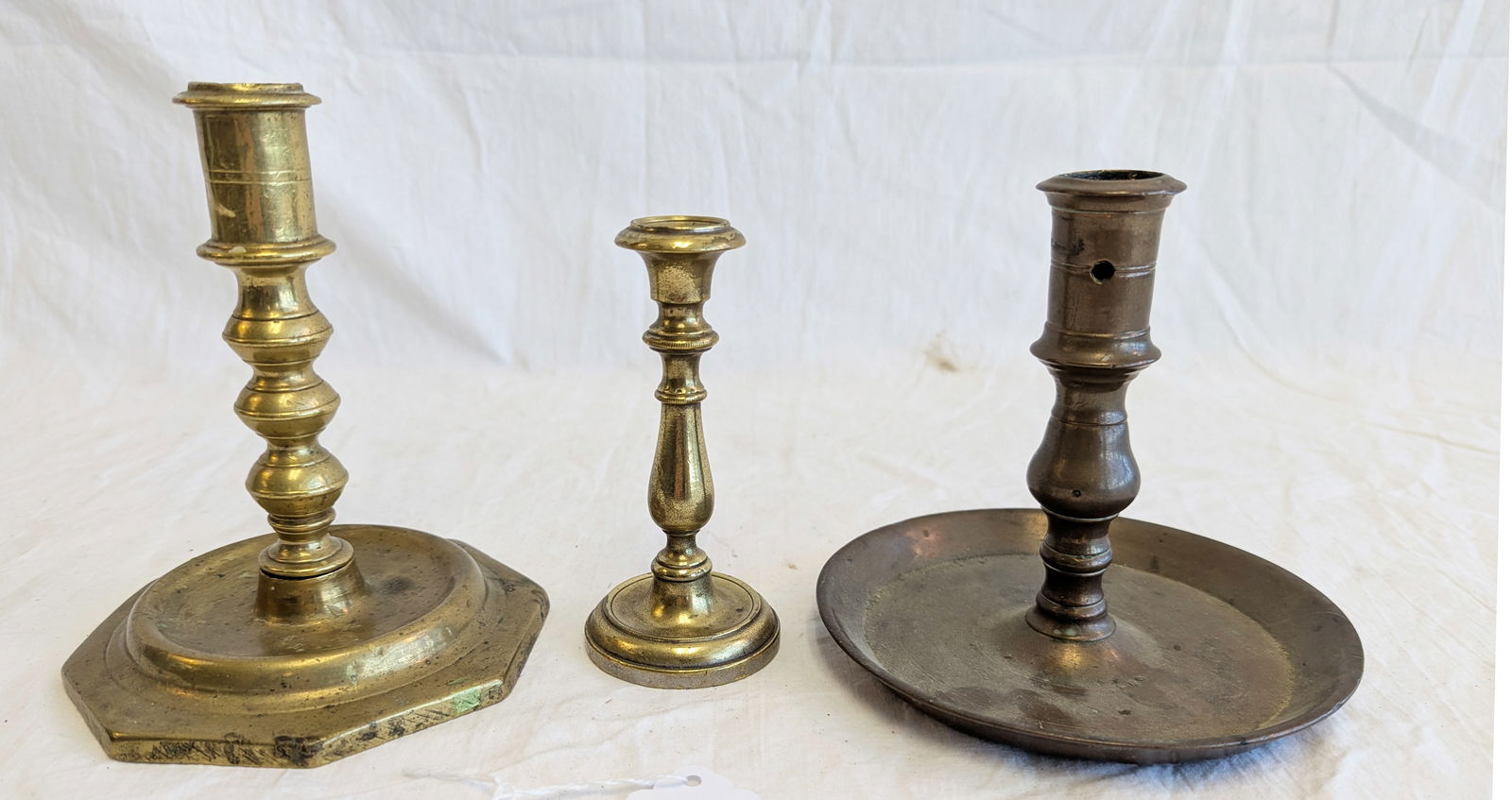 Lot of Three Early Brass Candlesticks. (1 of 8)