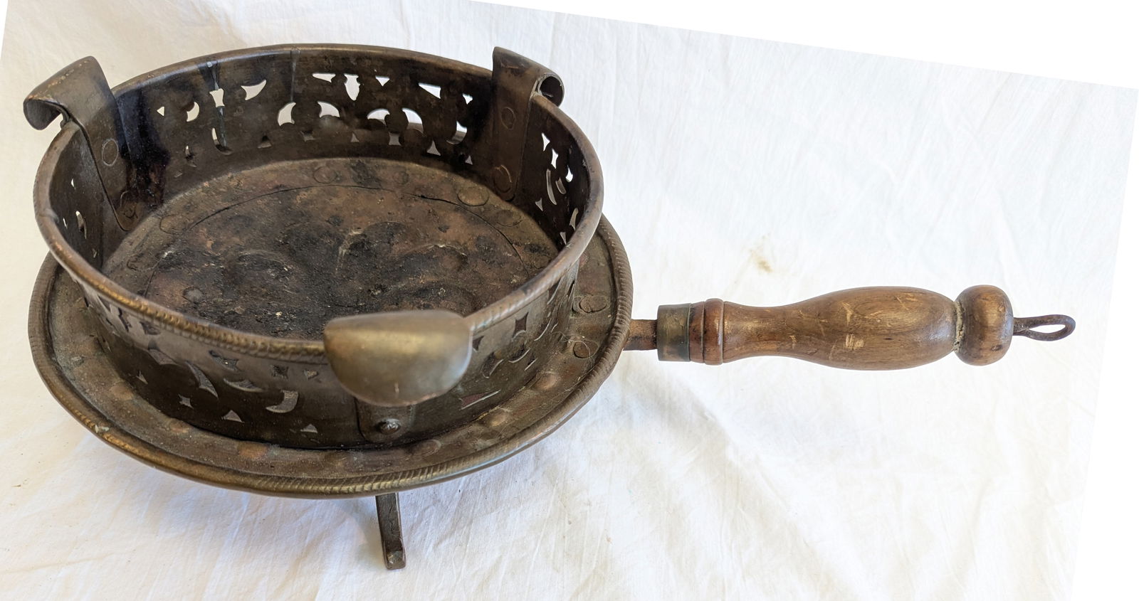 Wrought Iron and Brass Trivet with Wooden Handle. (1 of 9)