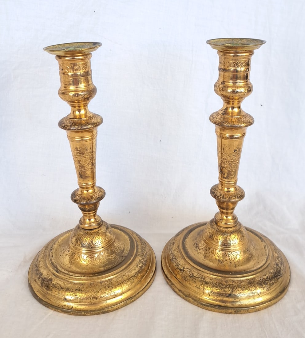 Pair of 18th Century Gilded and Engraved Candlesticks: Possible English or French. 8 1/2" tall x 4 3/4" at base.