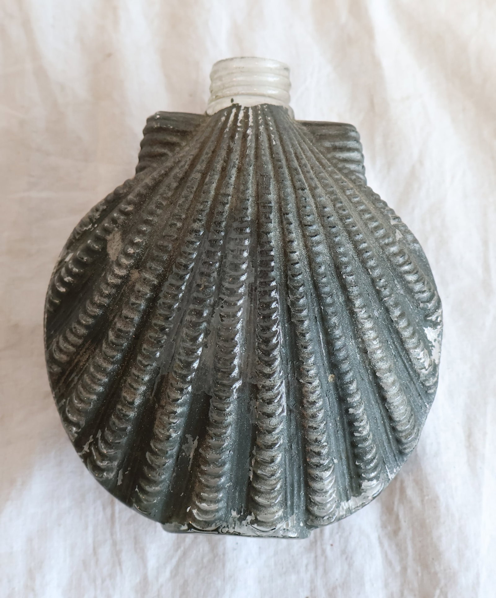 Figural Flask Shaped like a Seashell- Missing Lid: 4 1/8" x 4 3/4" x 2" Gurley Auction Company provides In House Packing and Shipping and strive to keep costs as reasonable as possible. Please take the time to research the cost of shipping for the ite