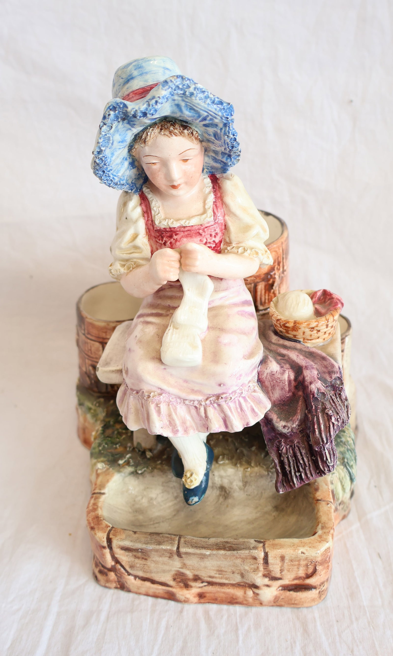 Ceramic Vase Depicting Girl Knitting: 8 1/2" x 7" x 6" Gurley Auction Company provides In House Packing and Shipping and strive to keep costs as reasonable as possible. Please take the time to research the cost of shipping for the items t