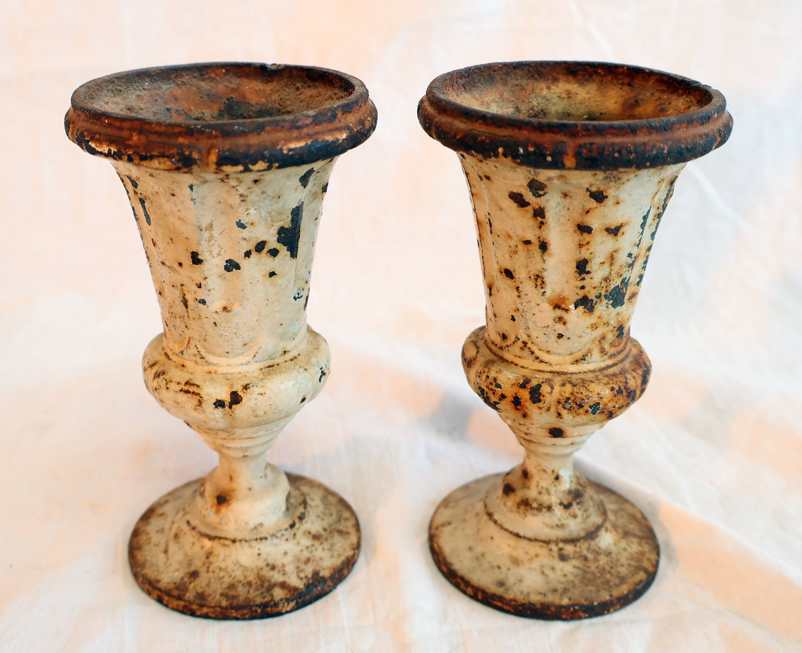 Pair of Small Cast Iron Urns: 5" x 2 3/4" at top Gurley Auction Company provides In House Packing and Shipping and strive to keep costs as reasonable as possible. Please take the time to research the cost of shipping for the items