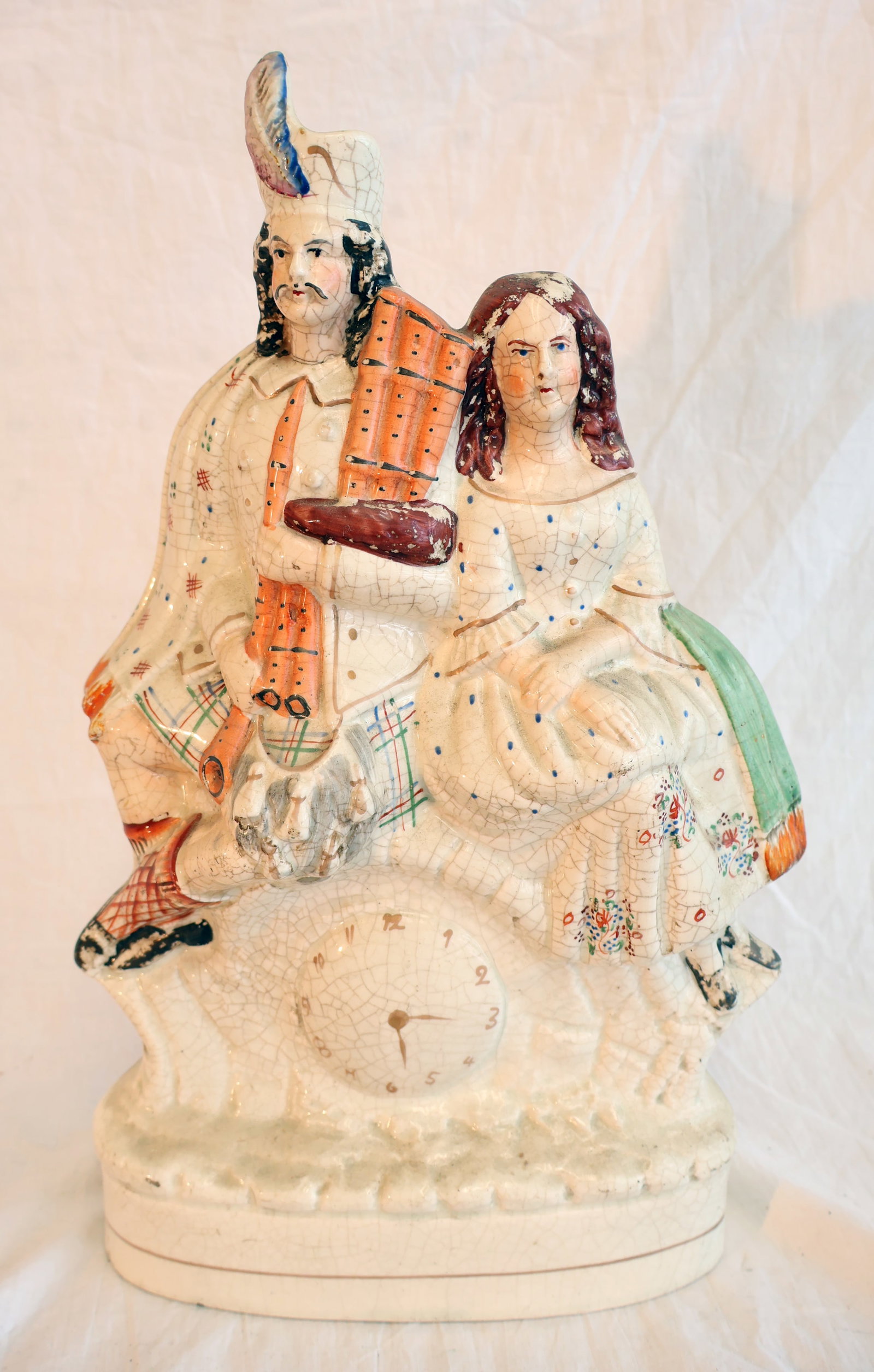 Staffordshire Figure of Couple with Clock: 13 1/2" x 9 1/2" x 3 1/2" Gurley Auction Company provides In House Packing and Shipping and strive to keep costs as reasonable as possible. Please take the time to research the cost of shipping for th
