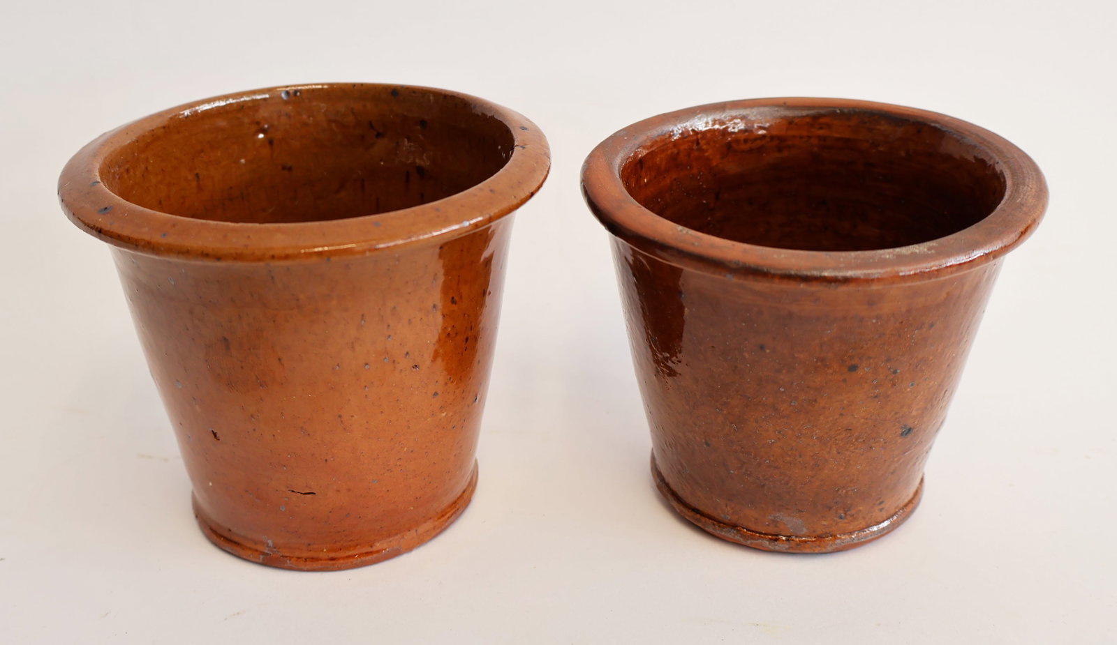 Lot of Two Redware Cups: 3 3/4" x 4 1/2" at top. 3 1/2" x 4 1/2" at top. Gurley Auction Company provides IN HOUSE PACKING AND SHIPPING and we strive to keep costs as reasonable as possible. Please take the time to research