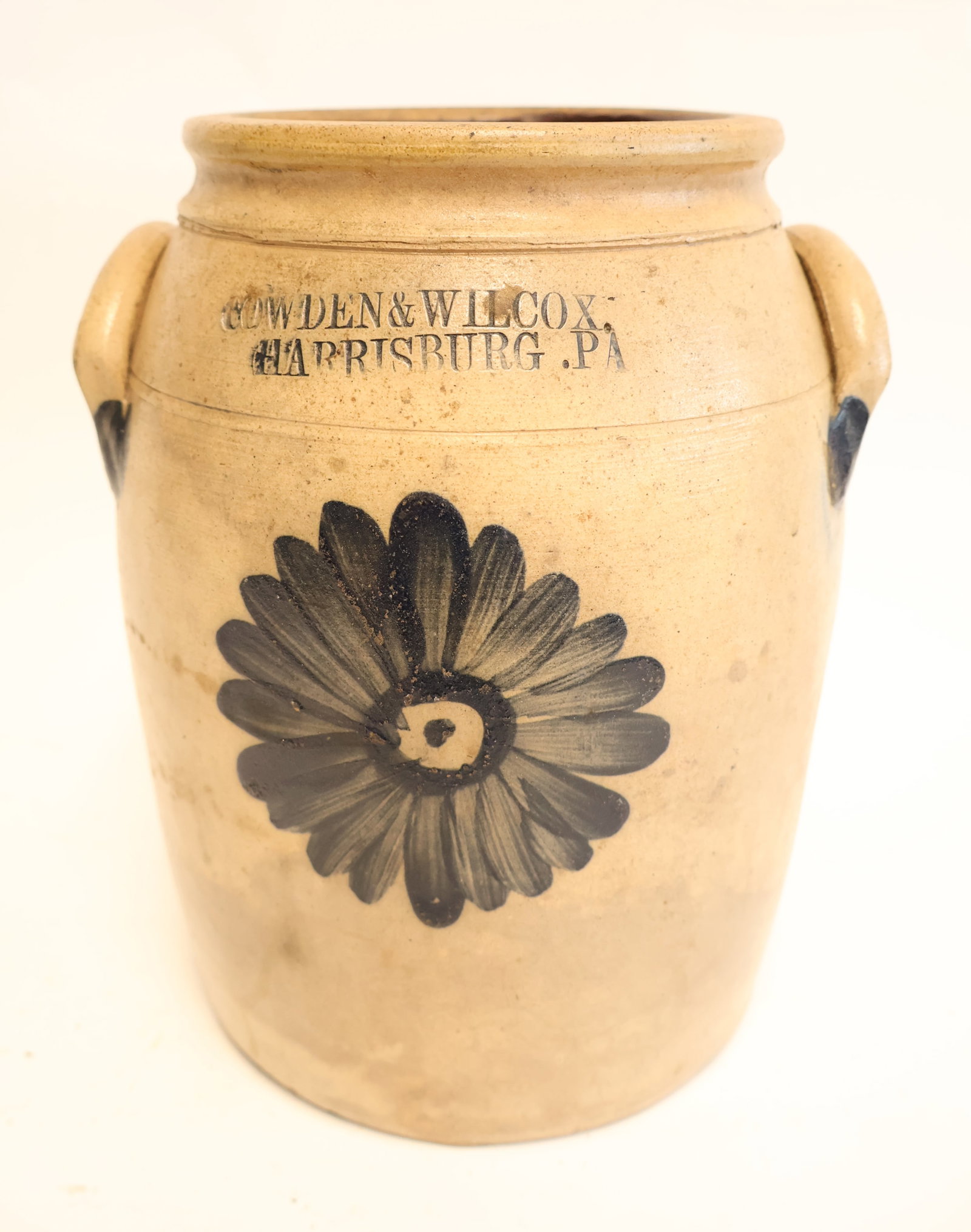 Early Stoneware Crock with Blue Flower Decoration by Cowden & Wilcox from Harrisburg, PA: 9 3/4" x 8" wide with handles Gurley Auction Company provides IN HOUSE PACKING AND SHIPPING and we strive to keep costs as reasonable as possible. Please take the time to research the cost of shipping
