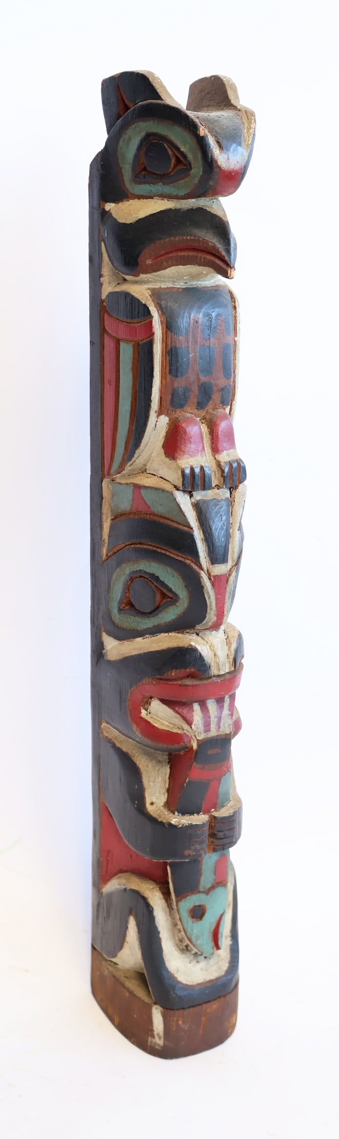 Northwest Coast Native American Carved Wooden Totem Pole: 18" x 3" x 2 1/2" Gurley Auction Company provides IN HOUSE PACKING AND SHIPPING and we strive to keep costs as reasonable as possible. Please take the time to research the cost of shipping for the ite