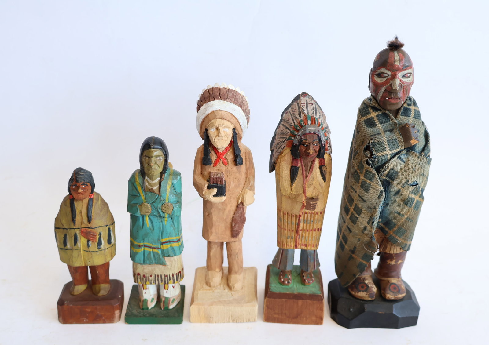 Lot of Five Wooden Carvings Depicting Native Americans: Largest: 8" tall Smallest: 4 3/4" tall Gurley Auction Company provides IN HOUSE PACKING AND SHIPPING and we strive to keep costs as reasonable as possible. Please take the time to research the cost of