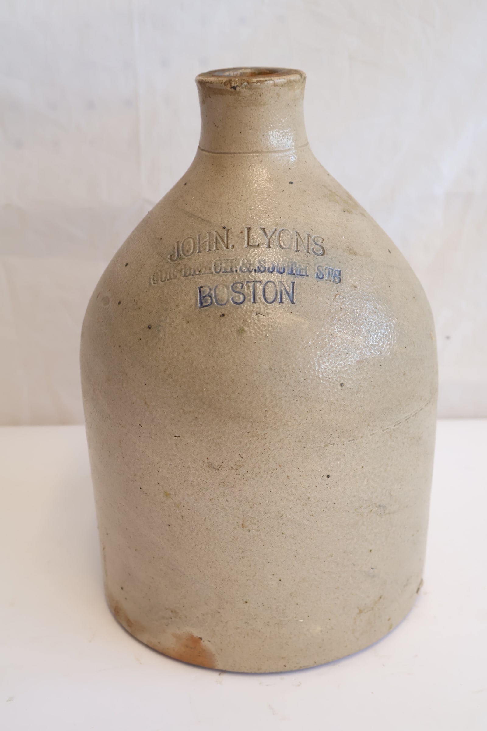 Early Stoneware Jug Stamped John Lyons Boston: 11 1/2" x 7" Gurley Auction Company provides IN HOUSE PACKING AND SHIPPING and we strive to keep costs as reasonable as possible. Please take the time to research the cost of shipping for the items th