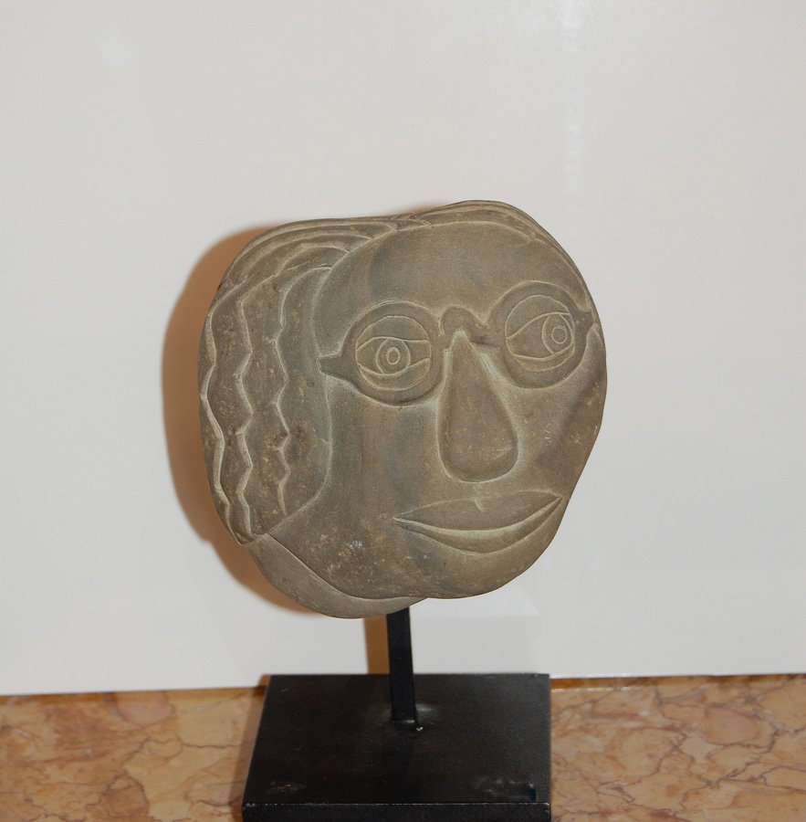 Marshall David (1936-) “Stone Head #1”: Marshall David (1936-) “Stone Head #1” carved stone with metal base Size:, 6.5"x 4" American naïve sculptor (b.1936)