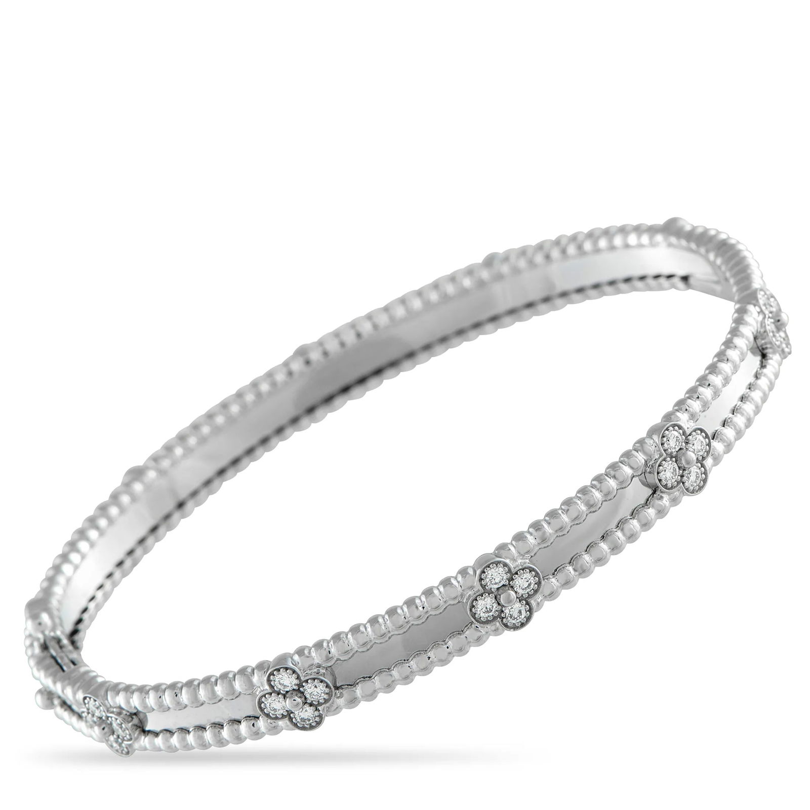 Van Cleef & ArpelsVan Cleef & Arpels Perlee Sweet Clover 18K White Gold 0.68ct Diamond Bracelet: Intricate beadwork adds texture and dimension to this Van Cleef & Arpels Perlee Sweet Clover bangle bracelet. The sleek, simple design is elevated by round-cut Diamonds with a total weight of 0.68 car
