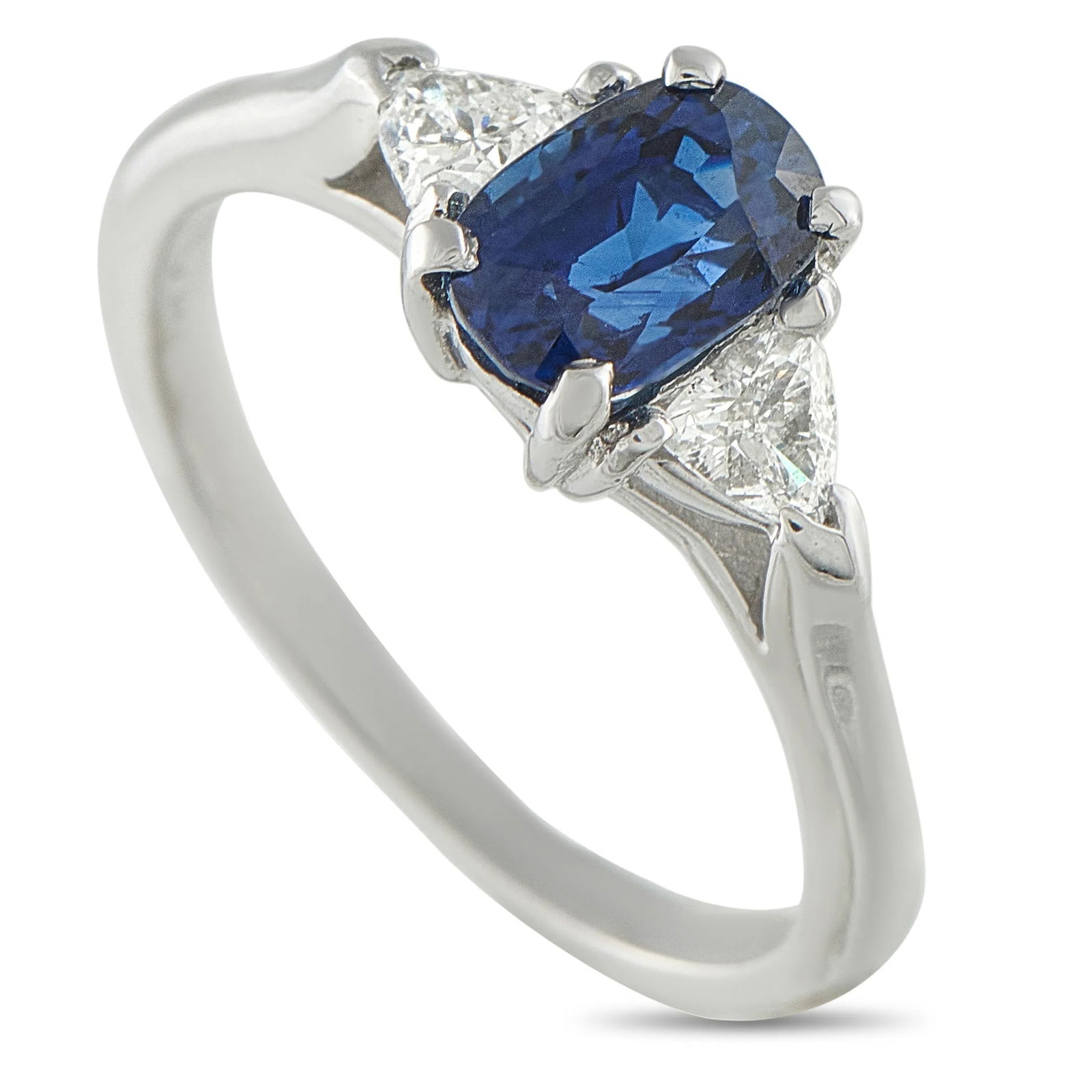 Van Cleef & Arpels Van Cleef & Arpels 18K White Gold Diamond and 1.37ct Sapphire Ring VC03-100725: A Van Cleef & Arpels three-stone ring that balances color and geometry with measured refinement. At its center is a 1.37 carat oval-cut blue sapphire flanked by two modified triangular brilliant diamo