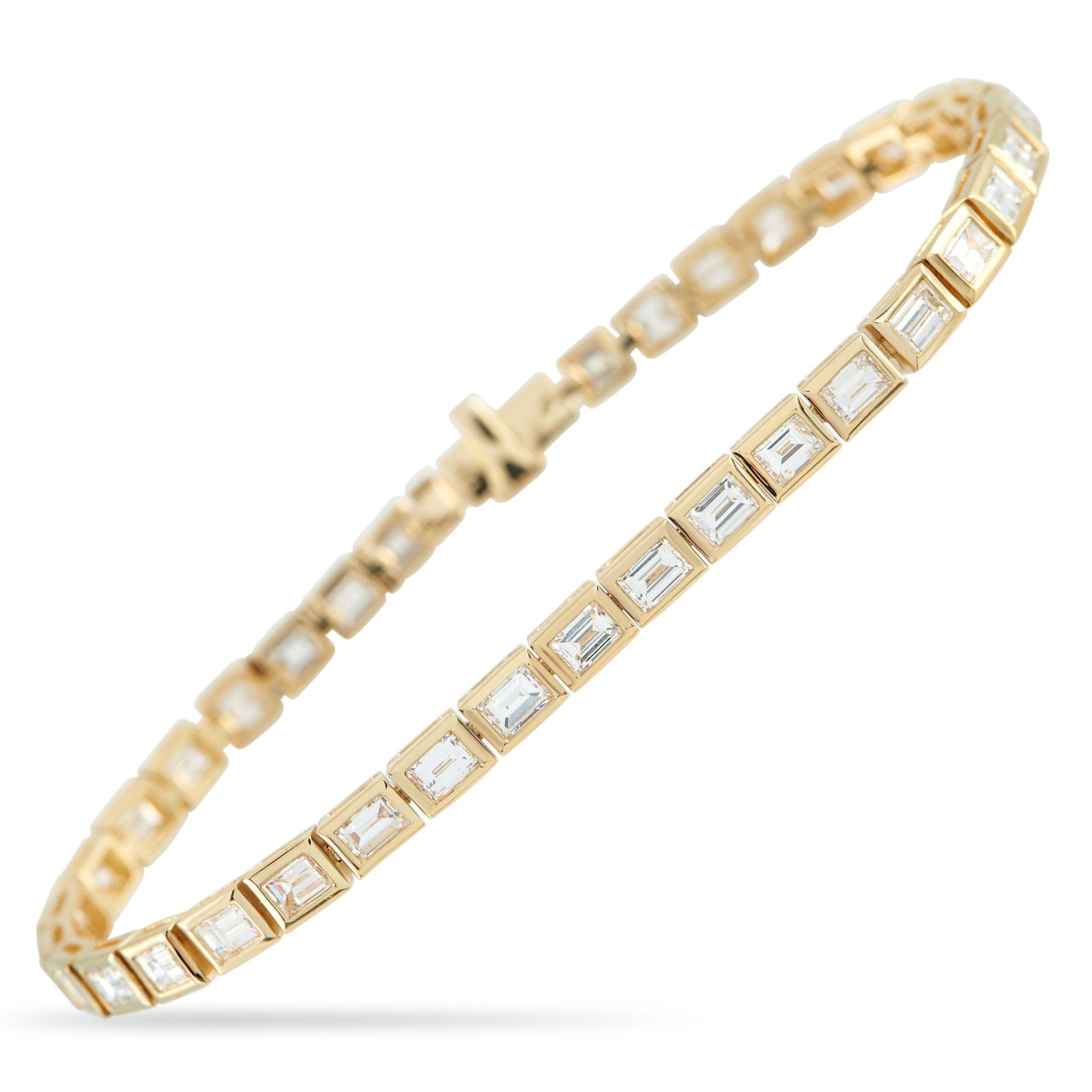 Exclusive 18K Yellow Gold 6.60ct Baguette Diamond Bracelet: Unconventional and strikingly modern, this diamond line bracelet showcases the crisp geometry and hall-of-mirrors brilliance of baguette diamonds. Each stone is flush-set in frames that trace their li