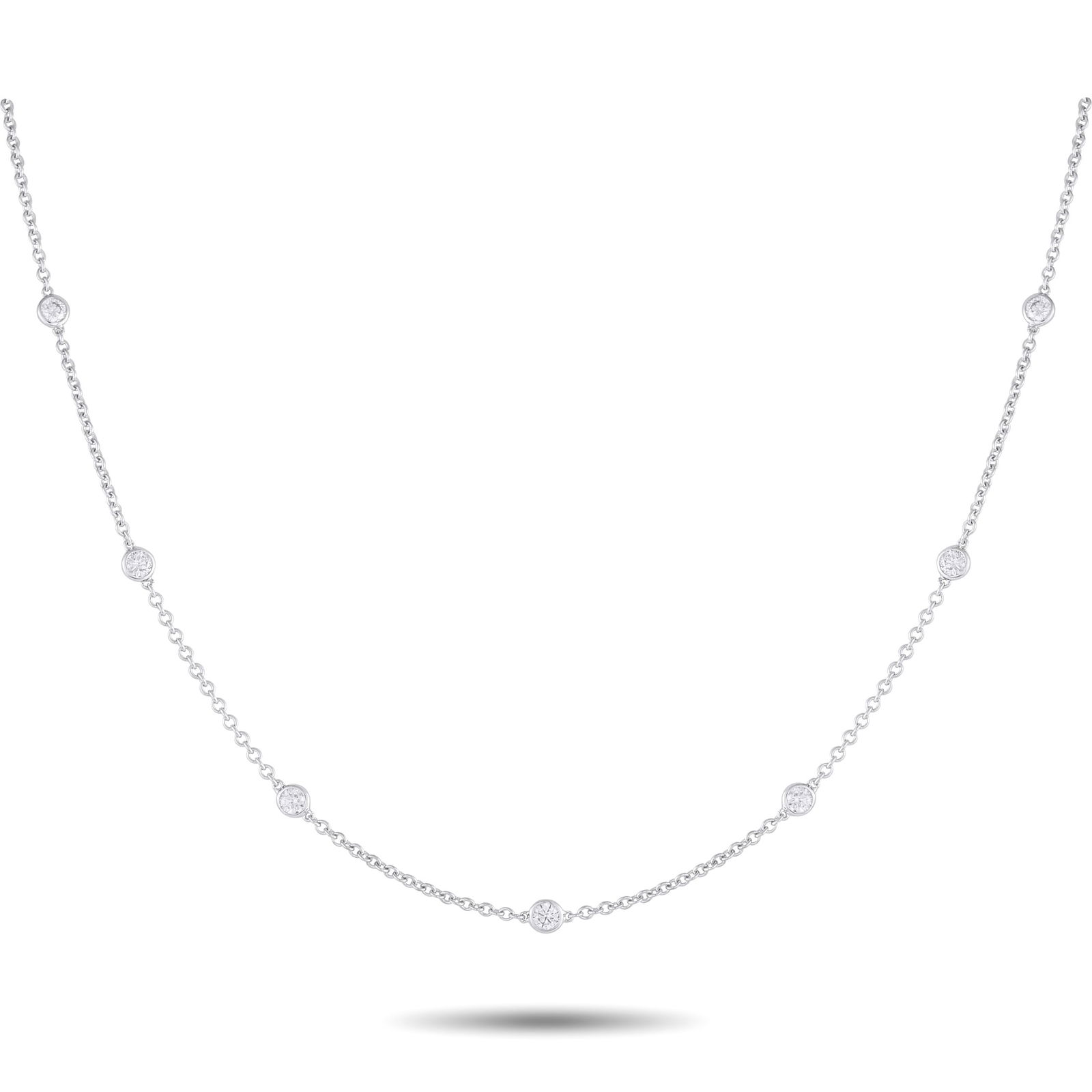 Exclusive 18K White Gold 0.75ct Diamond Station Necklace: This sophisticated necklace will make a subtle statement. Set in 18K White Gold, the delicate chain is elevated by a series of bezel set Diamonds totaling 0.75 carats. Ideal for everyday wear, this im