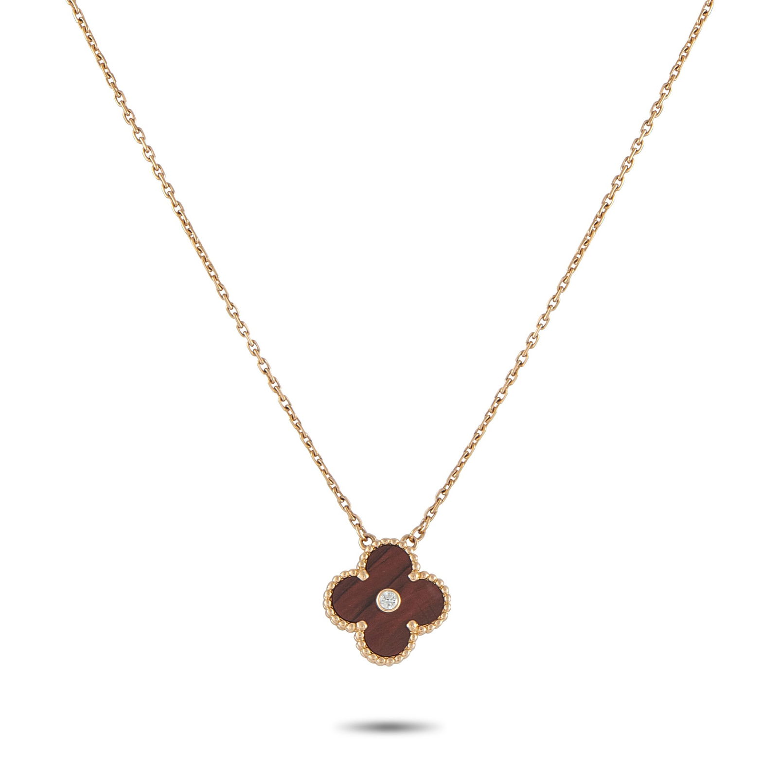 Van Cleef & Arpels Alhambra 18K Rose Gold Diamond and Bulls Eye Holiday Pendant: Effortless to wear and instantly recognizable, this Van Cleef & Arpels necklace stands as the perfect example of refined simplicity. It features the classic Alhambra four-leaf-clover motif as its pend