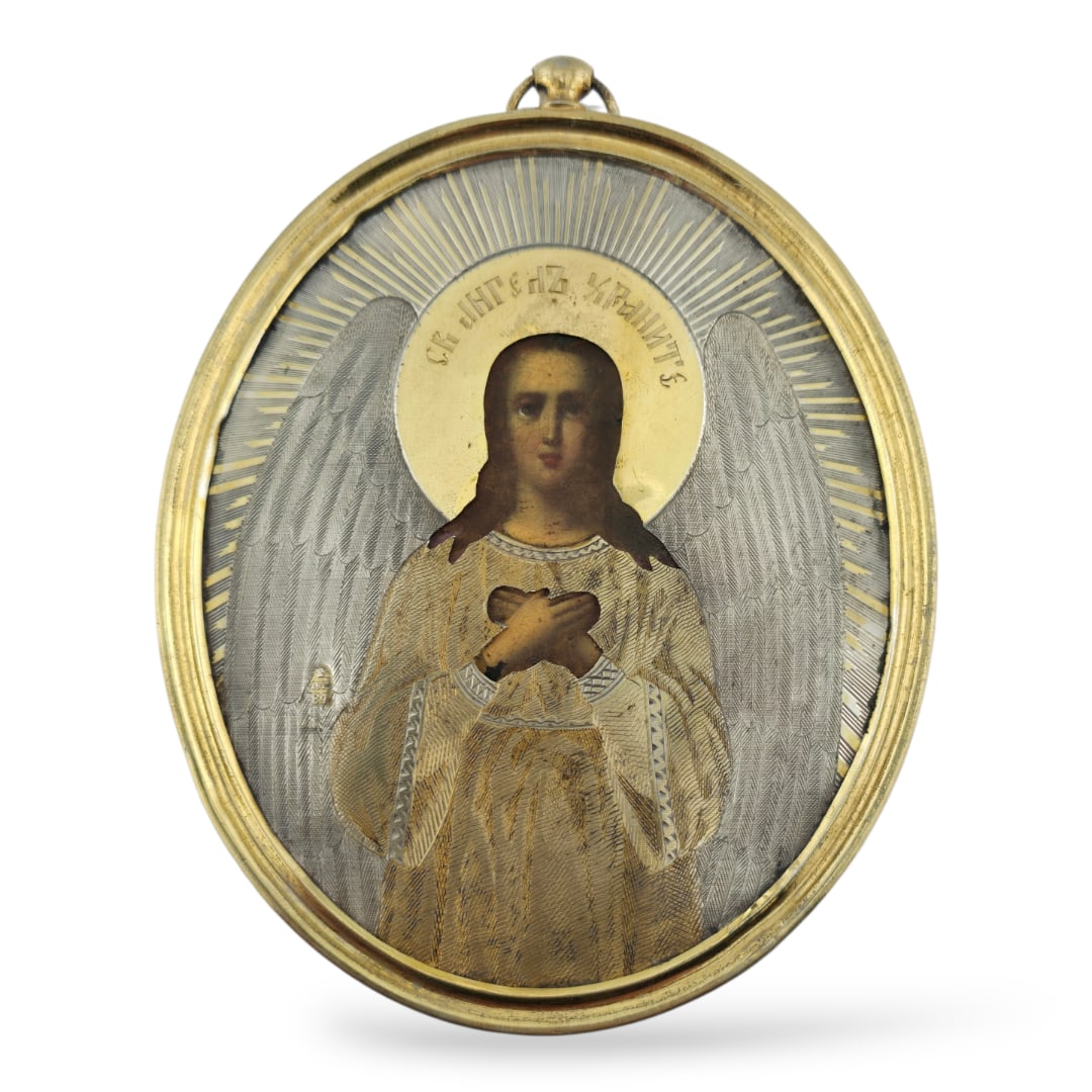 Russian Antique Silver Icon Guardian Angel Moscow, dated 1875: Russian Antique Silver Icon Guardian Angel Moscow, dated 1875Comprising an oval pendant-style Russian icon depicting the Holy Guardian Angel, as engraved in the halo, overlaid with a silver-gilt engra