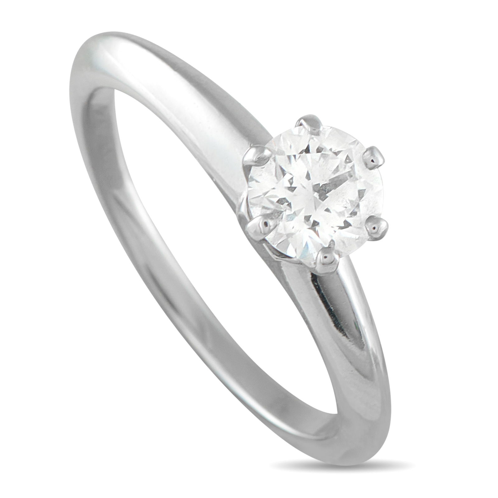 Tiffany & Co. Platinum 0.61ct Diamond Engagement Ring: This impeccably crafted Tiffany & Co. Diamond solitaire engagement ring will never go out of style. At the center of the simple Platinum setting, a round-cut 0.61 carat Diamond provides endless sparkl