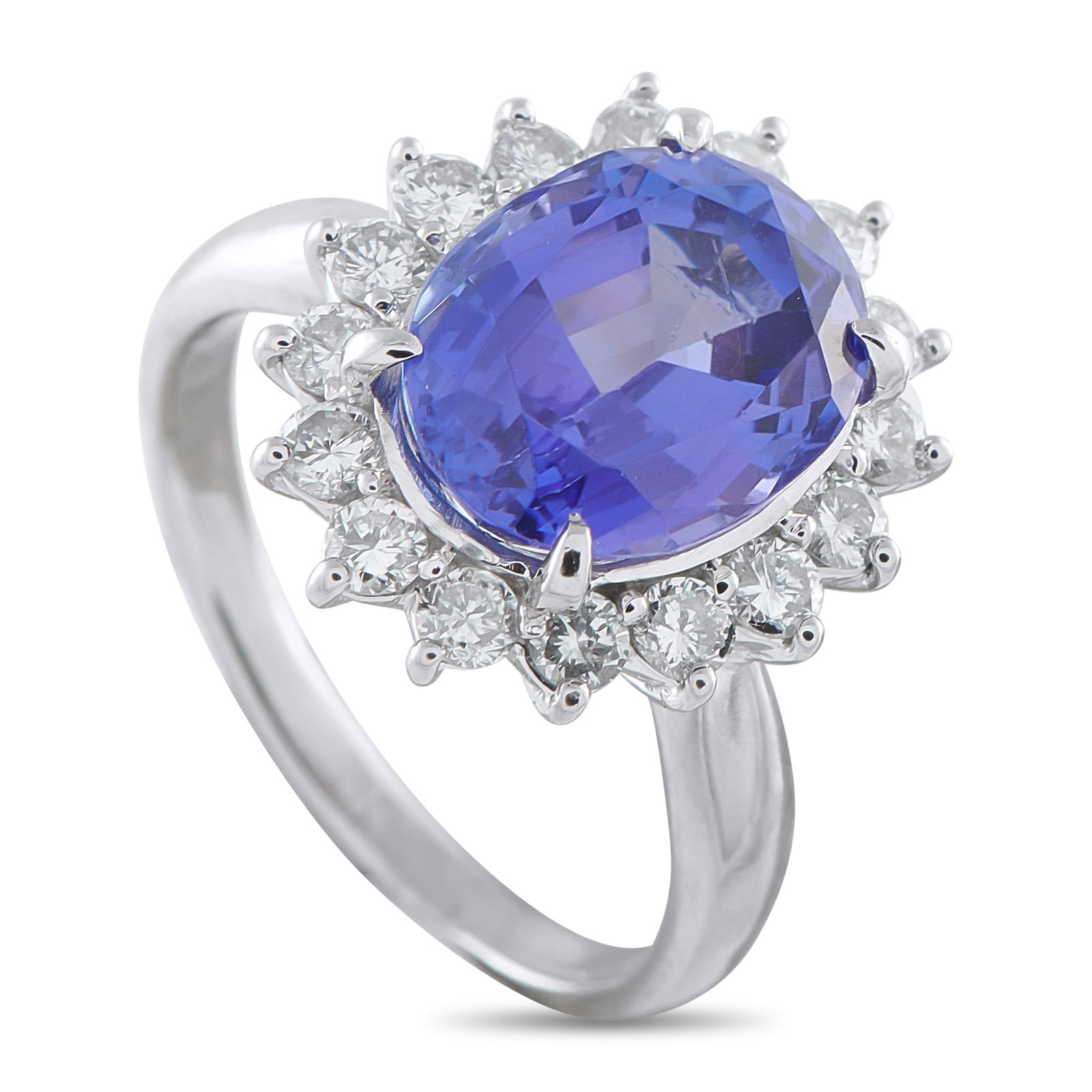 Exclusive Platinum 0.82ct Diamond and Tanzanite Ring: This Exclusive ring shows a remarkable 5.03-carat oval tanzanite, a stone chosen for its deep blue color with violet undertones. It is held securely by four prongs. Around it is a halo of round diamon