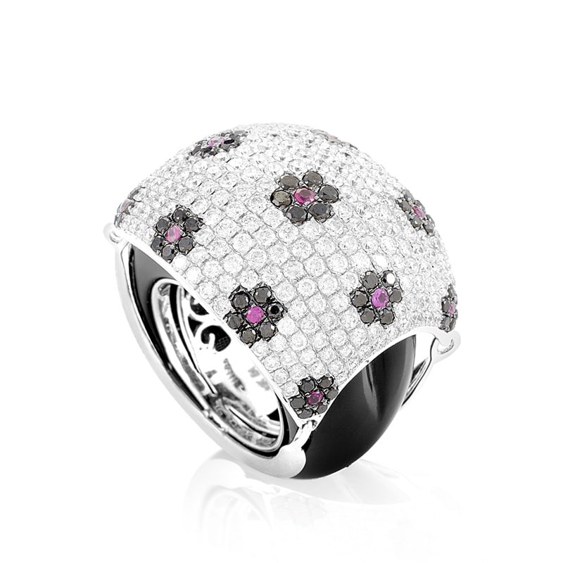 Exclusive 18K White Gold Floral Gemstone Pave Dome Ring: This exceptionally feminine ring glitters with a rare and luxurious elegance. The ring is made of 18 white gold and boasts shanks accented with black onyx. Lastly, the domed portion of the ring is set