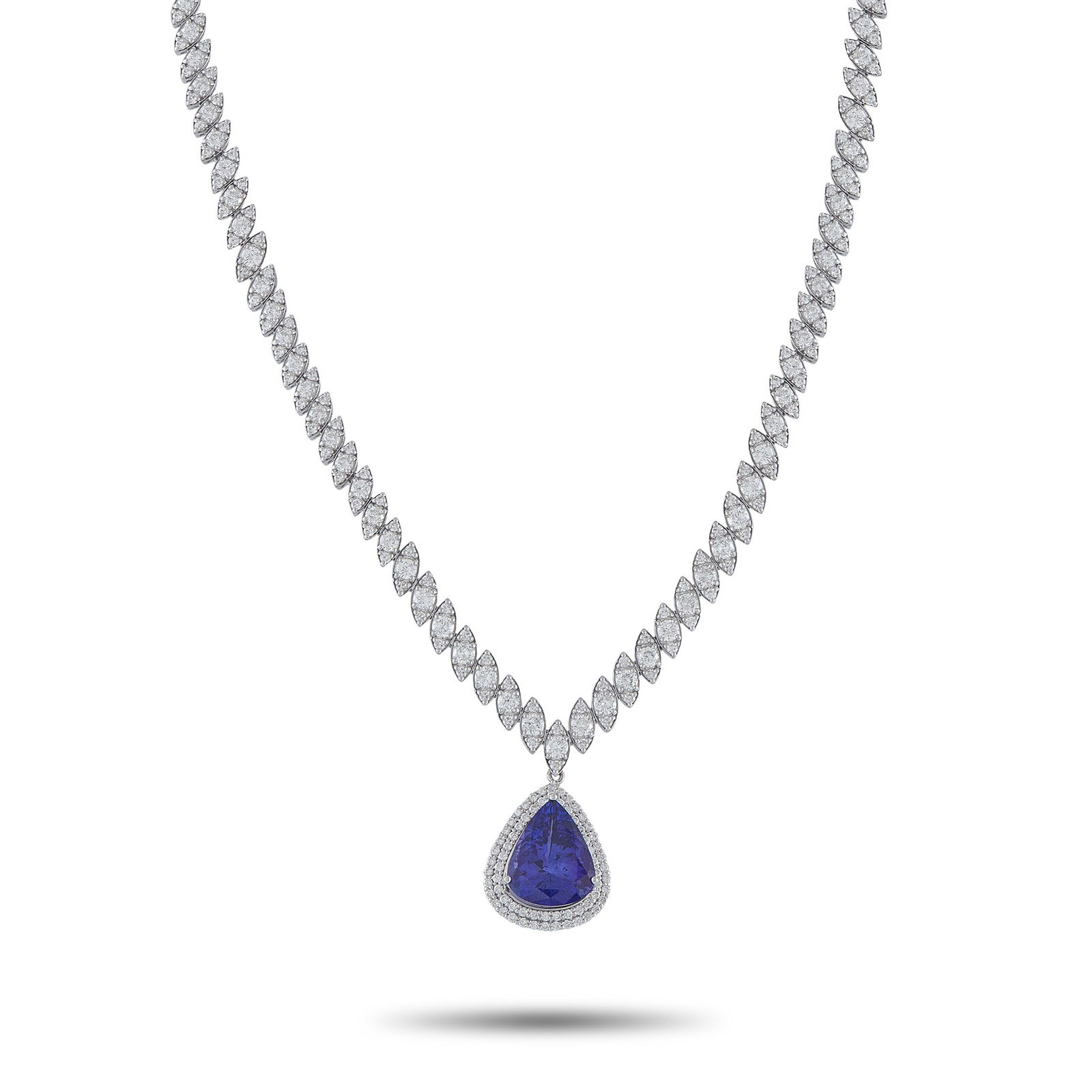 Exclusive 18K White Gold 10.03ct Diamond and Tanzanite Necklace: This breathtaking necklace is worthy of even your most special occasions. Diamonds with a total weight of 10.03 carats elevate the 16”chain. This piece’s pendant is adorned with additional Dia