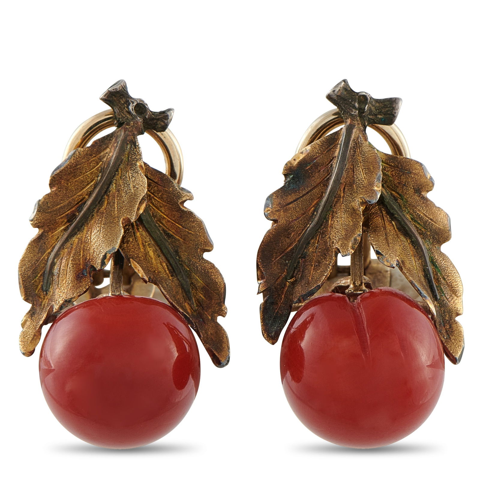 Buccellati18K Yellow Gold Coral Clip-On Earrings: Opulent leaf motifs crafted from 18K Yellow Gold make these Buccellati earrings a veritable work of art. Below, glossy 12mm Coral accents provide the unique design with warmth, color, and sophisticati