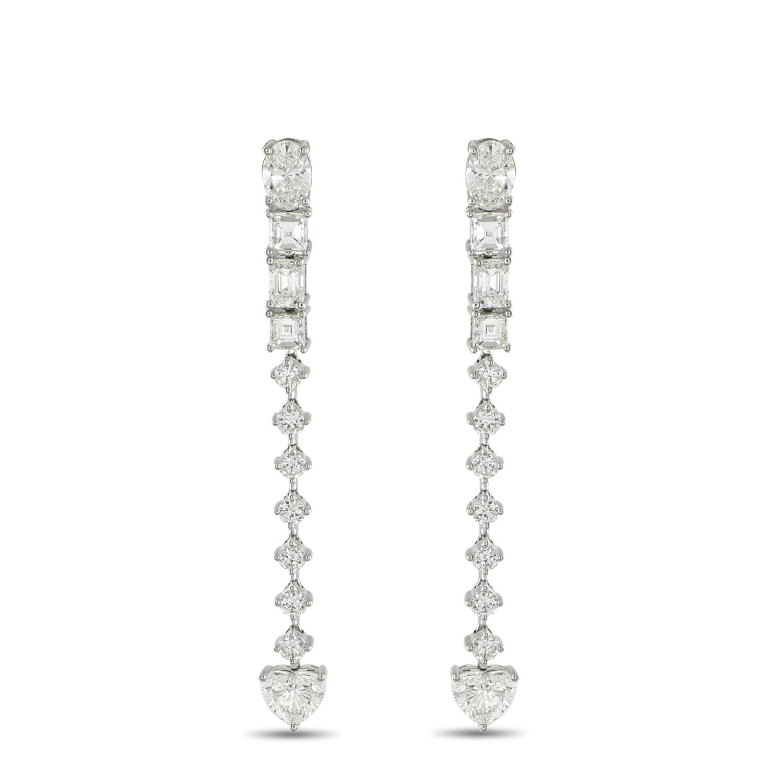 Exclusive 18K White Gold 3.95ct Diamond Dangle Earrings: Geometry meets romance in these 18K white gold dangle earrings. Like a story told in facets, these earrings begin with an oval diamond at the post. Step-cut diamonds mark the rhythm, followed by a ver