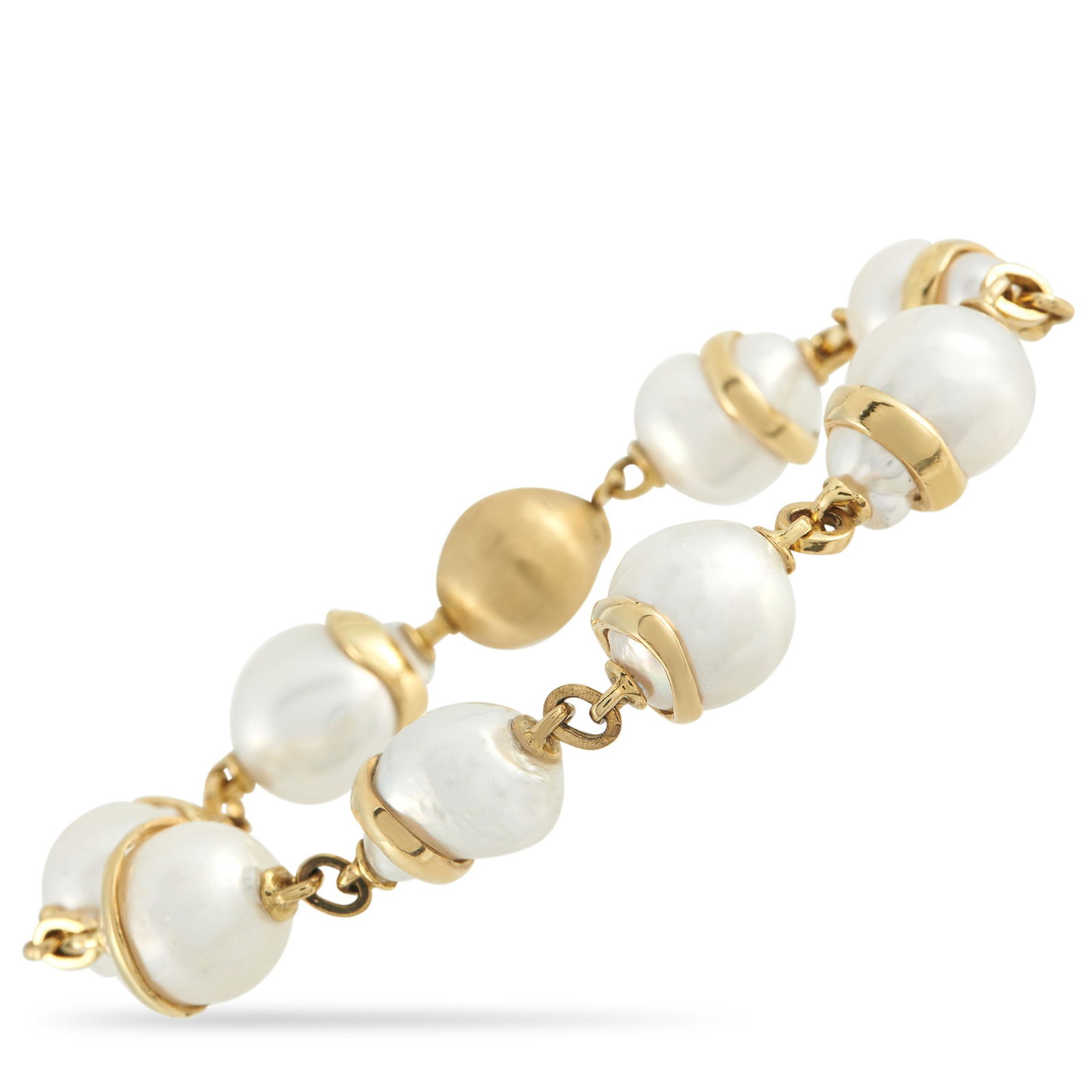 Yvel 18K Yellow Gold Baroque Pearl Bracelet: This Yvel bracelet strings together a series of baroque pearls chosen for their natural, uneven shapes. Each pearl is supported by a curved gold collar that follows the gem’s organic lines. One text