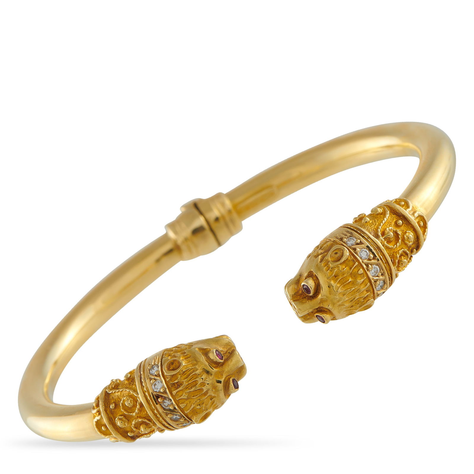 Ilias Lalaounis18k Yellow Gold Gem-Set: An 18K yellow gold bangle by Ilias Lalaounis, known for drawing from ancient Greek history and myth. This rigid and hinged open bangle features two inward-facing lion heads. Each head is finely worked