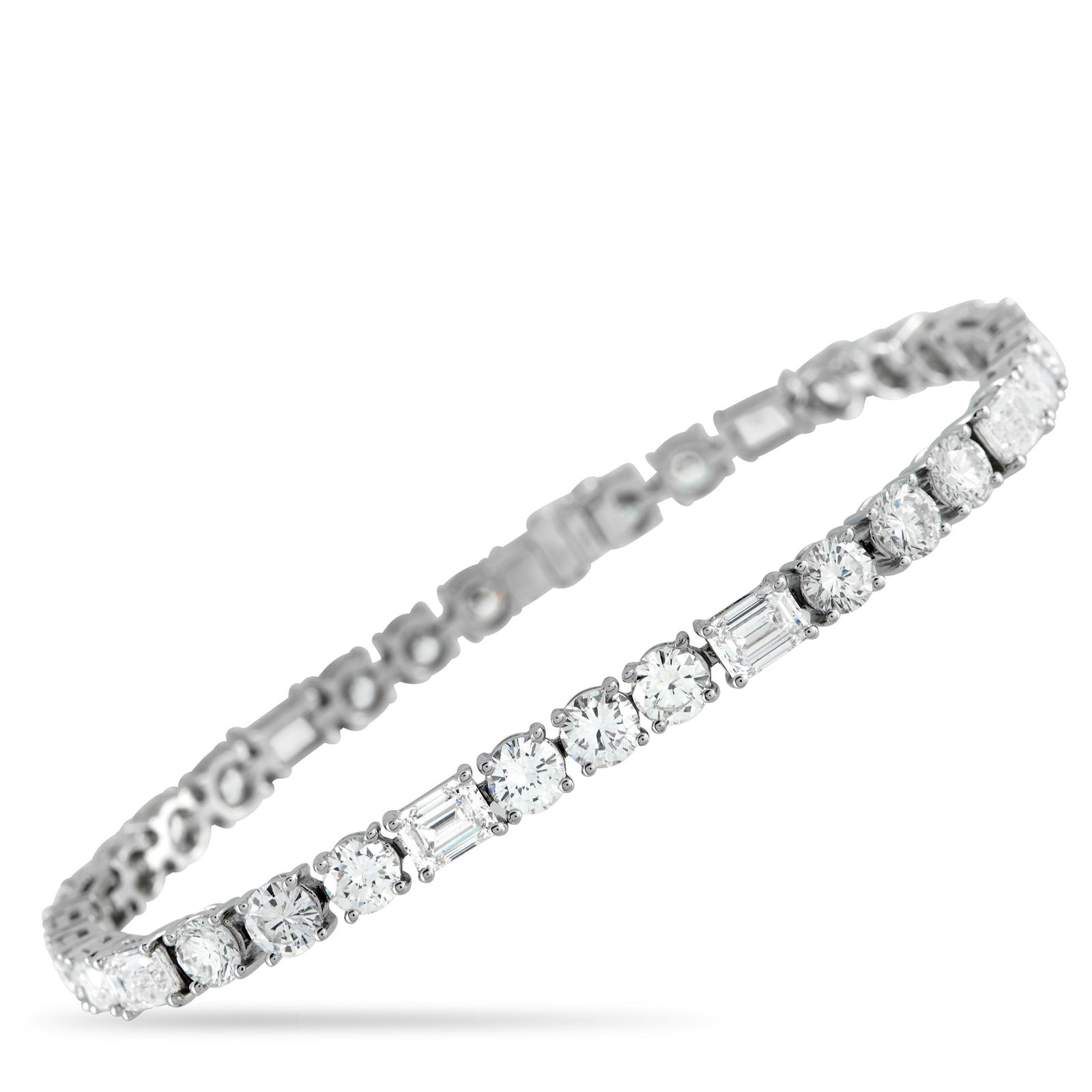 Exclusive 18K White Gold 13.10ct Diamond Tennis Bracelet: This tennis bracelet offers a unique take on a classic accessory. A combination of round cut Diamonds totaling 8.50 carats and emerald cut Diamonds totaling 4.60 carats make it a luxurious addition to