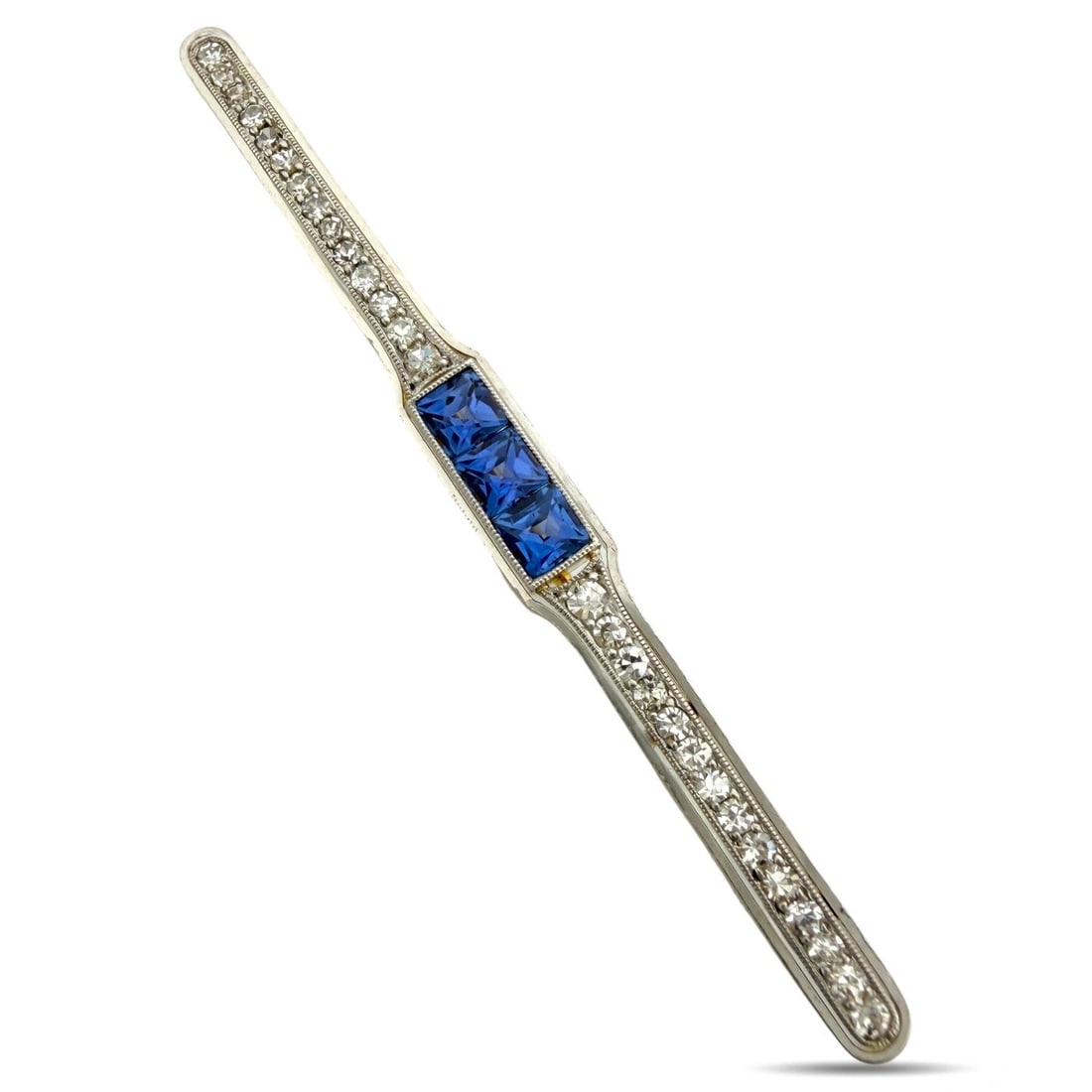 Brooch - 18 kt. Yellow gold, Platinum, Exclusive Platinum and 18K Yellow Gold 0.42ct Diamond and: Exclusive Platinum and 18K Yellow Gold 0.42ct Diamond and 0.60ct Sapphire BroochThis refined brooch brings together platinum and gold in a graceful linear design set with a bright arrangement of diamo