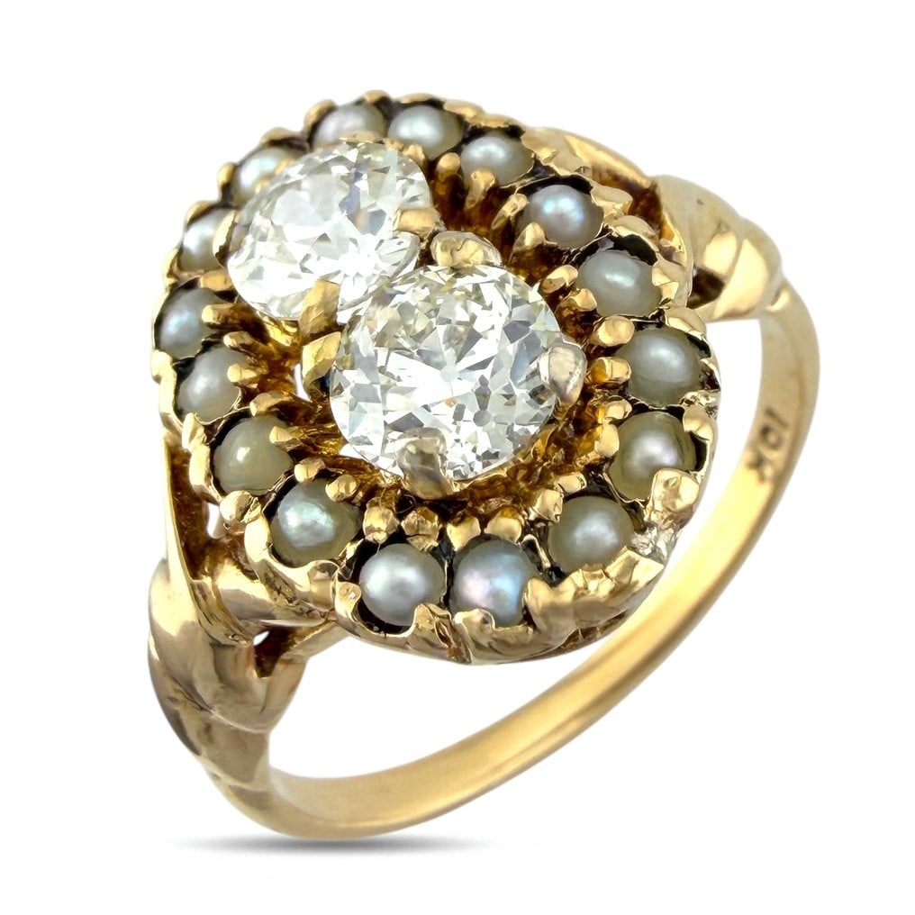 Ring - 10 kt. Yellow gold, Exclusive Yellow Gold 1.00ct Diamond and Pearl Ring - 1.00ct. tw.: Exclusive 10K Yellow Gold 1.00ct Diamond and Pearl RingThis charming ring features two bright center diamonds framed by a soft halo of pearls that lend the piece a refined and elegant character. The w