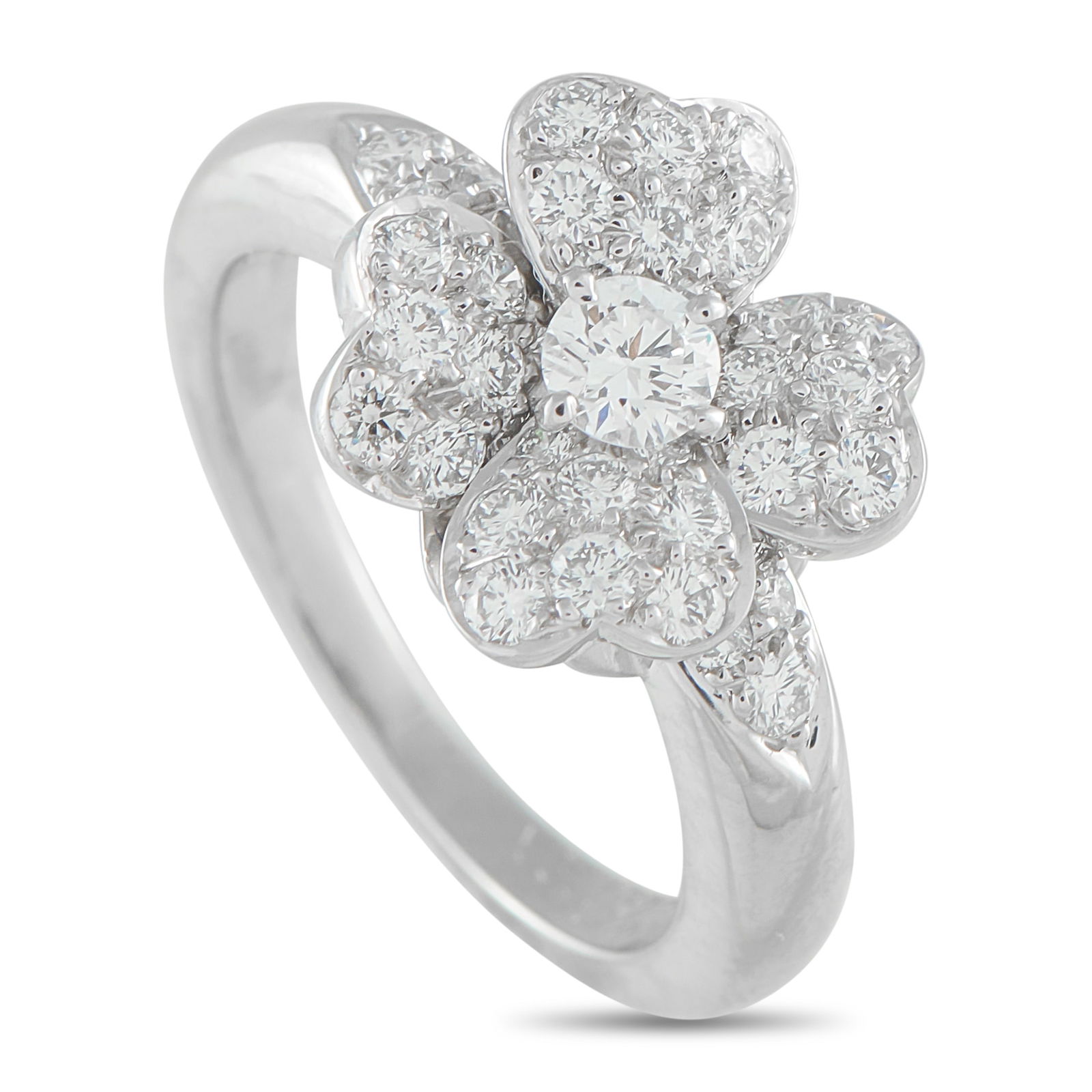 Van Cleef & Arpels Cosmos Platinum Diamond Ring: This Van Cleef & Arpels Cosmos ring is simply exquisite. On this impeccably crafted piece, four heart-shaped petals surround a sparkling center stone to create a timeless floral motif. Covered in Diam