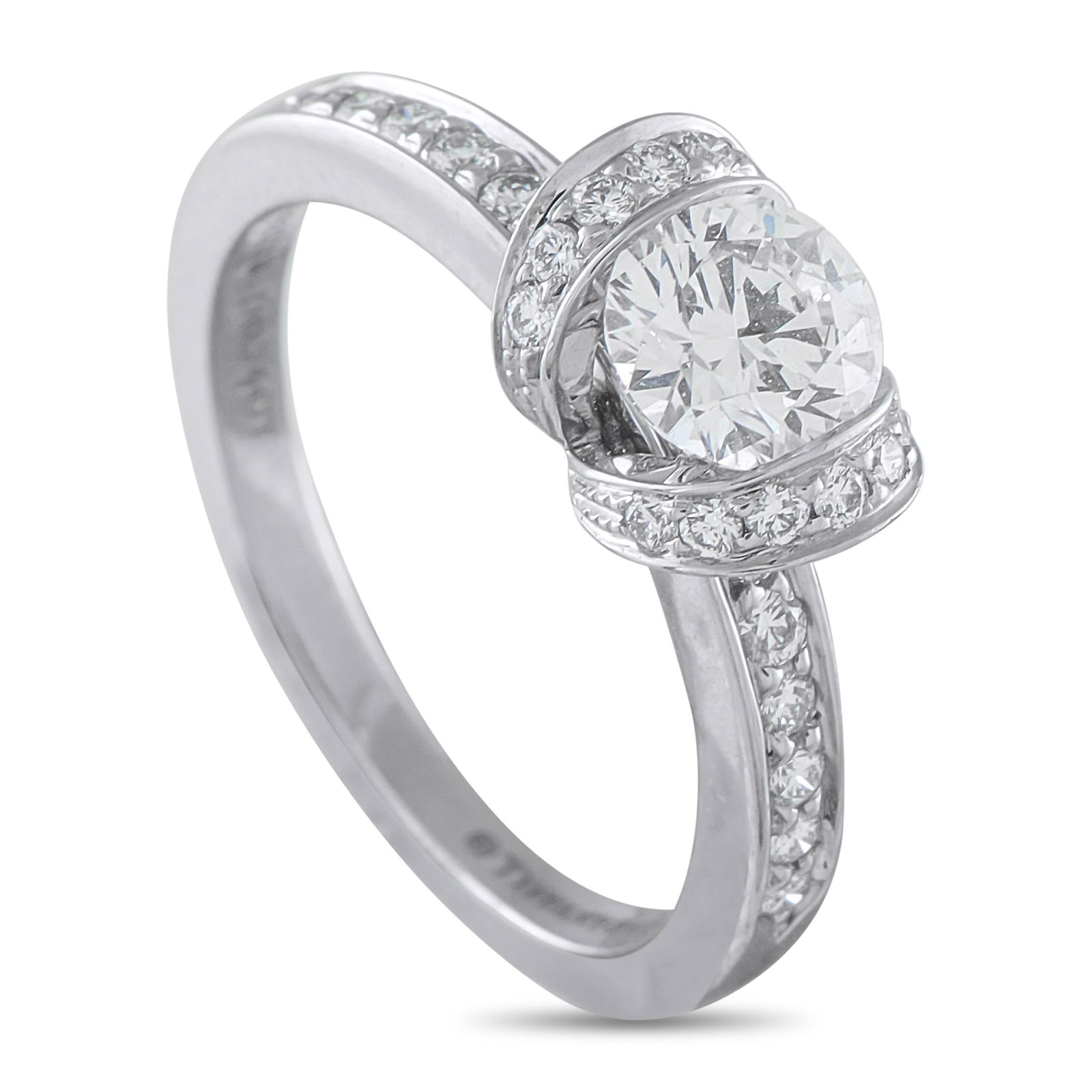 Tiffany & Co. Ribbon Platinum 1.04ct Diamond Ribbon Engagement Ring: This Tiffany & Co. Ribbon engagement ring is instantly captivating. On this exquisite piece, a 0.74 carat round-cut Diamond center stone is surrounded by scintillating ribbon motifs. Diamonds with a t