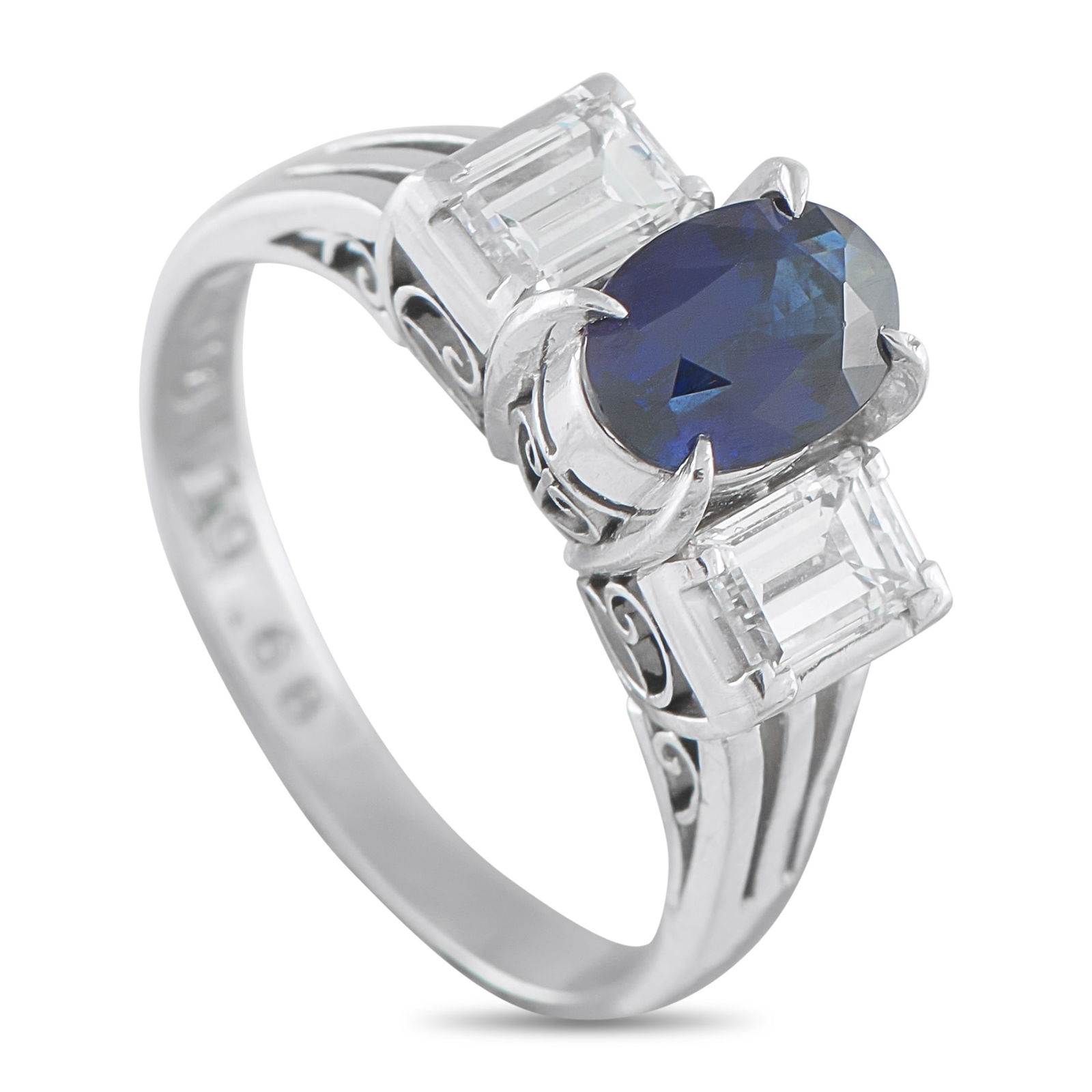 Exclusive Platinum 0.68ct Diamond and Sapphire Three-Stone Ring: This ring’s beauty lives in the contrast of color and brilliance, sharp form, and timeless appeal. It features a 1.19-carat oval sapphire framed by emerald-cut diamonds, rising on a platinum band wi
