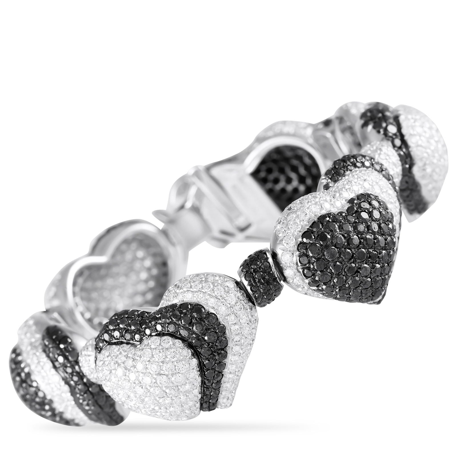 de Grisogono 18K White Gold 21.70ct Diamond Black and White Hearts Bracelet: Showy, shapely, and stunning, this remarkable bracelet by de Grisogono impresses with its 21.70 carats of black and white diamonds. The white gold bracelet features diamond-studded domed hearts linked