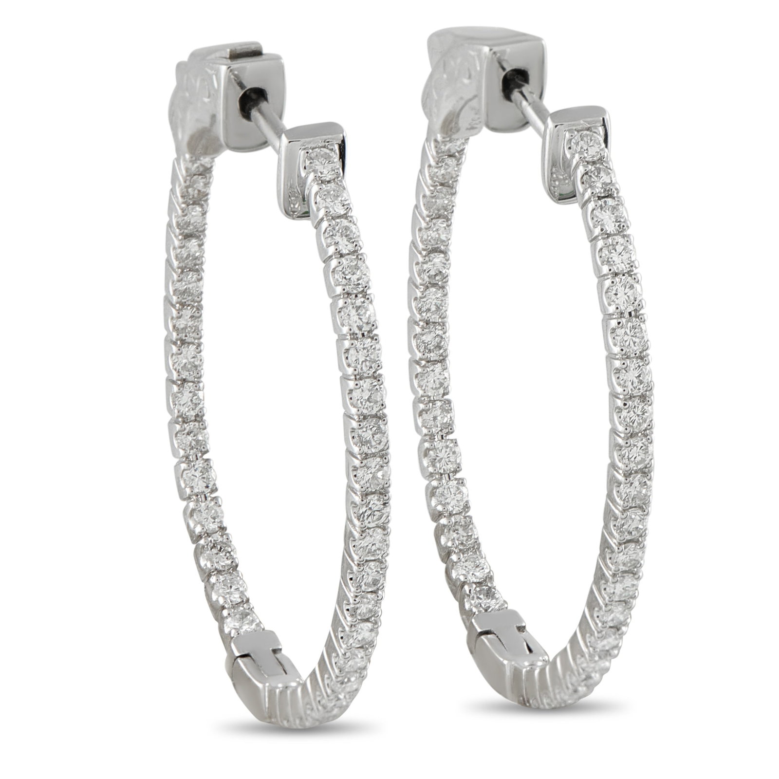 Exclusive 14K White Gold 1.07ct Diamond Inside-Out Hoop Earrings: Diamonds with a total weight of 1.07 carats add plenty of sparkle to these classic hoop earrings. Ideal for any occasion, each earring is crafted from 14K White Gold and measures 1.25” long by 1