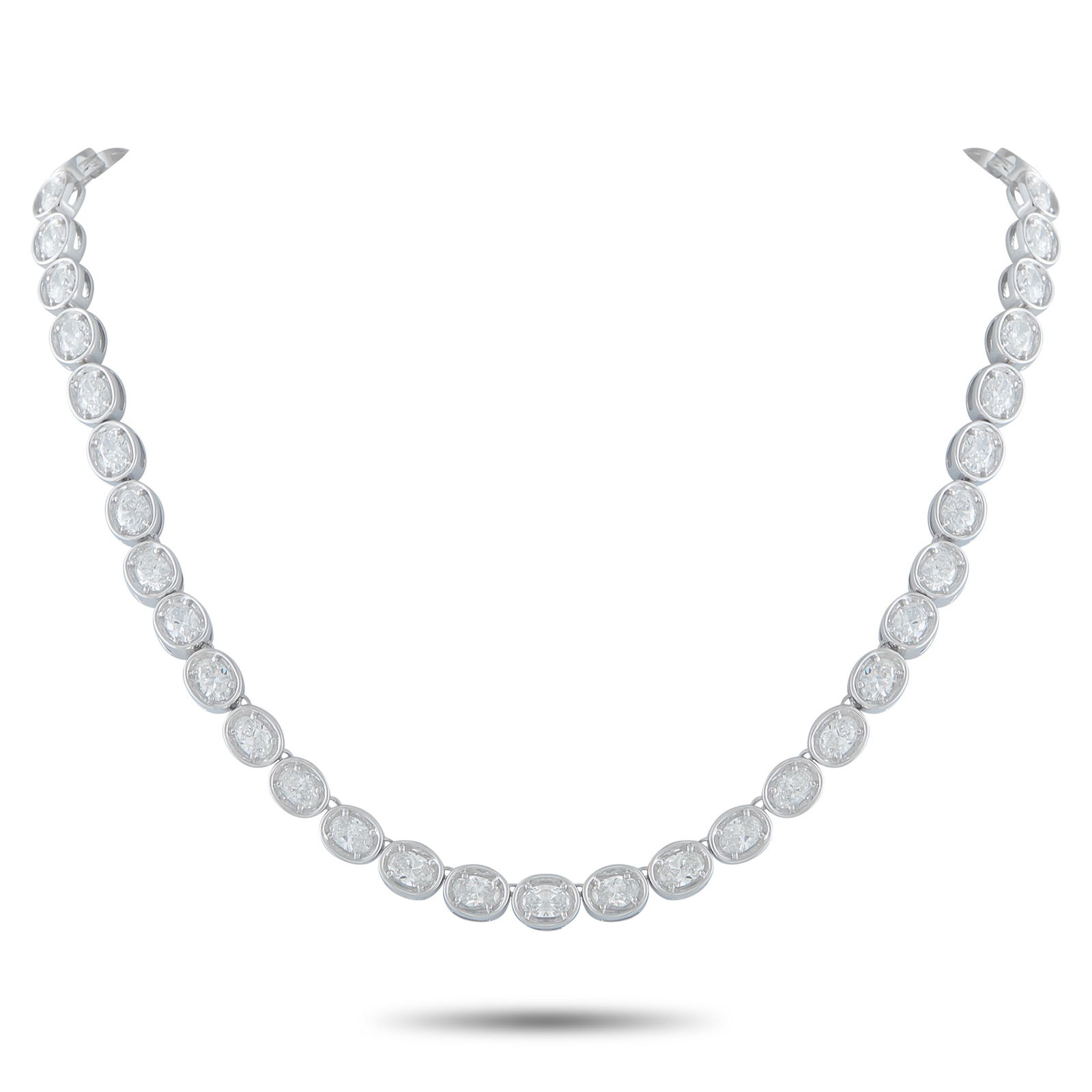Exclusive 18K White Gold 20.8 ct Diamond Oval Link Necklace: Cast in 18K white gold, this 15-inch necklace presents 20.8-carat brilliance through carefully linked oval frames. Each elongated section cradles one oval diamond, secured by four prongs that allow li