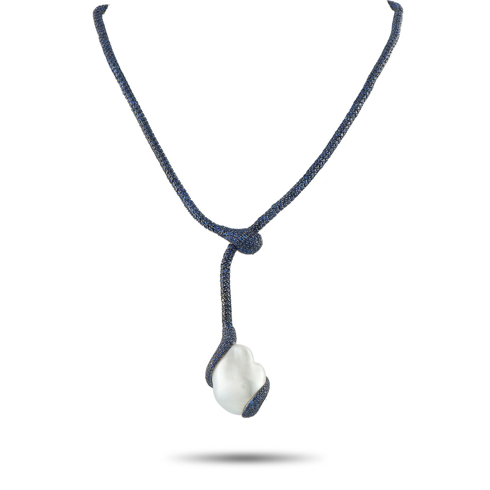 Yvel 18K White Gold Sapphire and Baroque Pearl Lariat Necklace: This Yvel necklace is endlessly captivating. The dramatic design is elevated by Sapphire gemstones, which cover the entirety of the 18K White Gold setting. A single Baroque Pearl pendant serves as a s