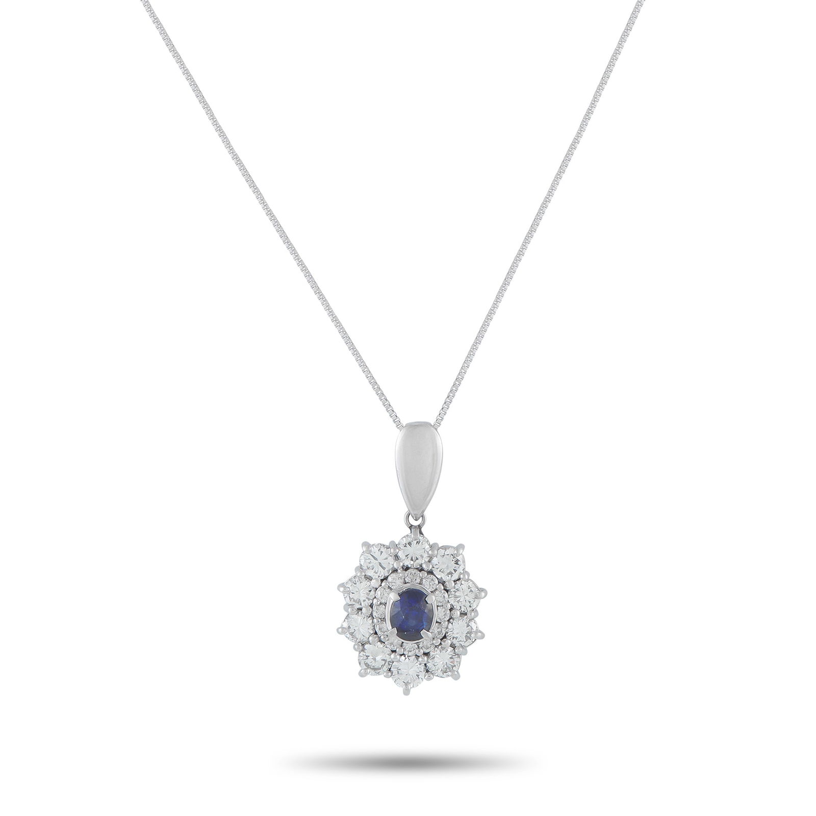 Exclusive Platinum 1.25ct Diamond and Sapphire Pendant: This luxury necklace is simply radiant. On this impressive piece, a 1.11 carat Sapphire center stone is surrounded by a double halo of Diamonds totaling 1.25 carats. Set in Platinum, the pendant measu